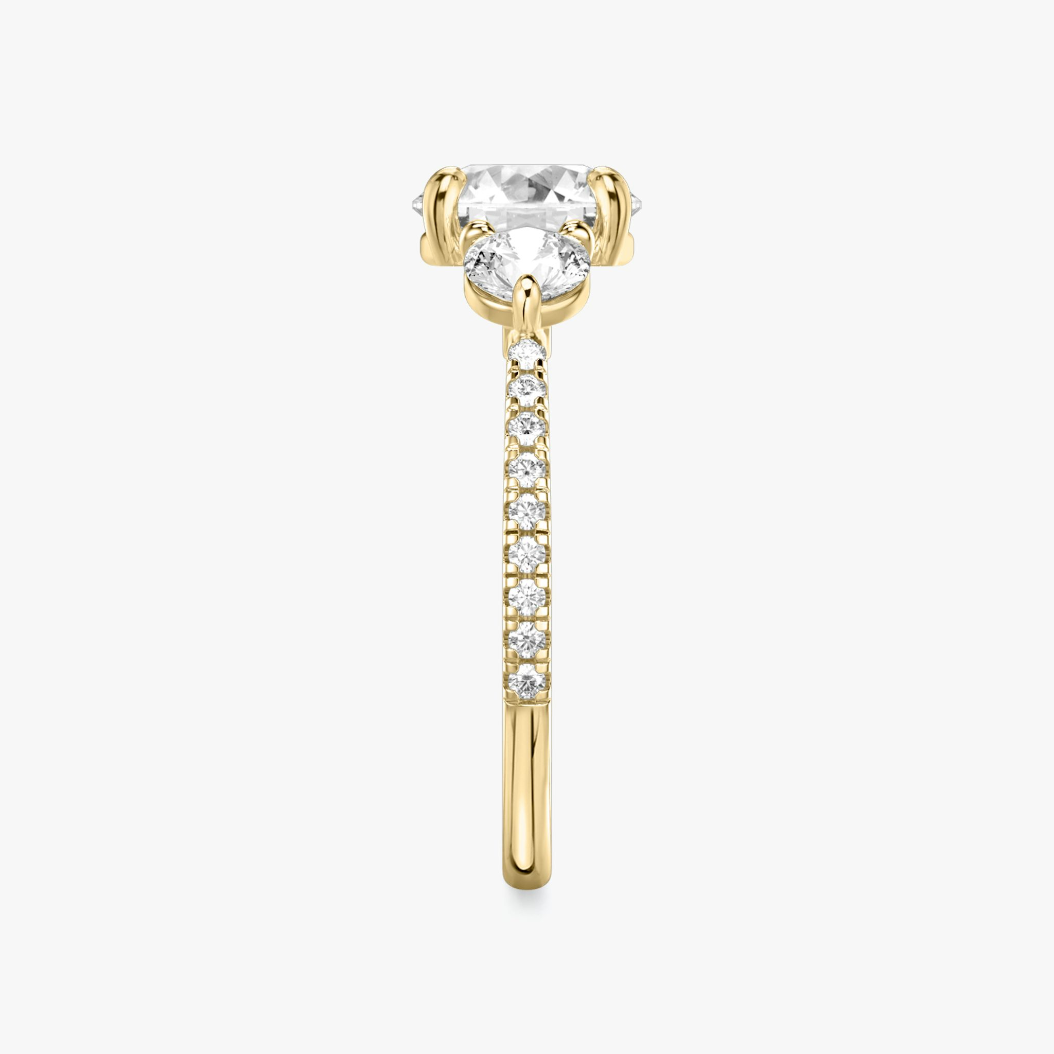 The Three Stone | Round Brilliant | 18k | Yellow Gold | bandAccent: Pavé | caratWeight: other | sideStoneCarat: 0.25ct | sideStoneShape: Round Brilliant | diamondOrientation: vertical