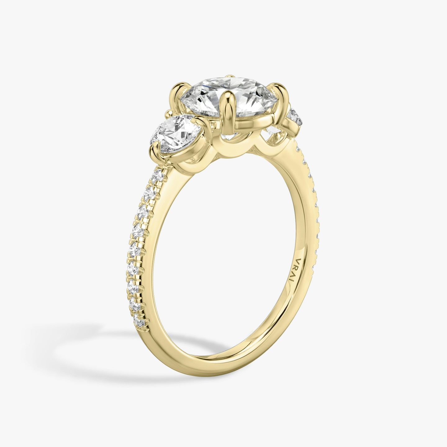 The Three Stone | Round Brilliant | 18k | Yellow Gold | bandAccent: Pavé | caratWeight: other | sideStoneCarat: 0.25ct | sideStoneShape: Round Brilliant | diamondOrientation: vertical