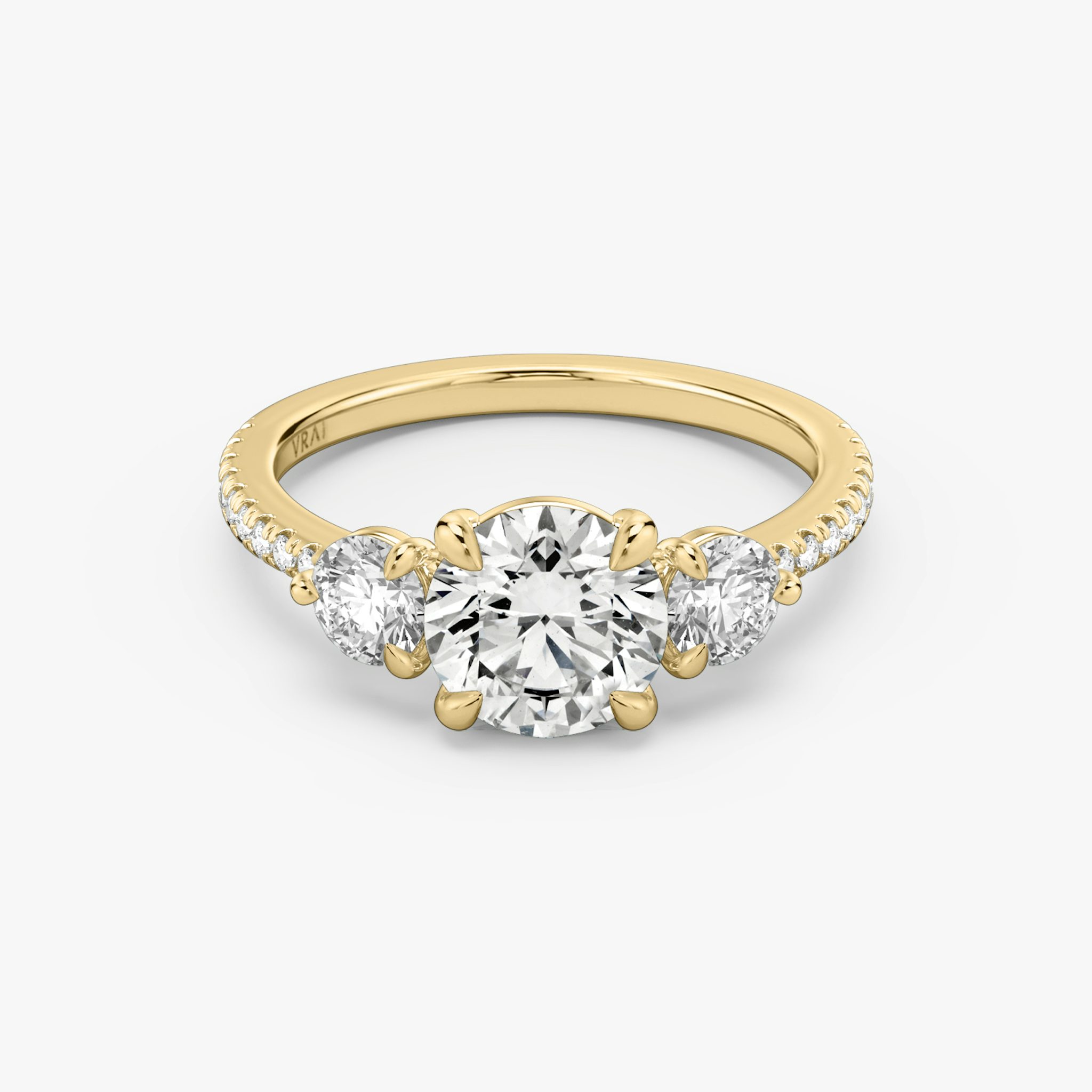 The Three Stone | Round Brilliant | 18k | Yellow Gold | bandAccent: Pavé | caratWeight: other | sideStoneCarat: 0.25ct | sideStoneShape: Round Brilliant | diamondOrientation: vertical