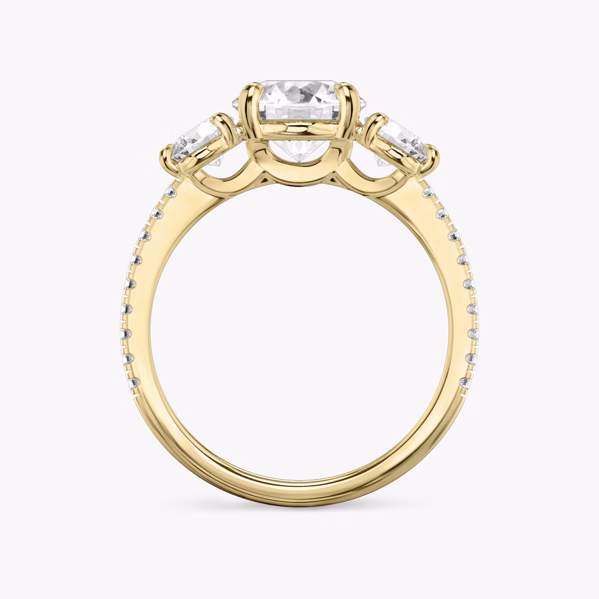 The Three Stone | Round Brilliant | 18k | Yellow Gold | bandAccent: Pavé | caratWeight: other | sideStoneCarat: 0.25ct | sideStoneShape: Round Brilliant | diamondOrientation: vertical