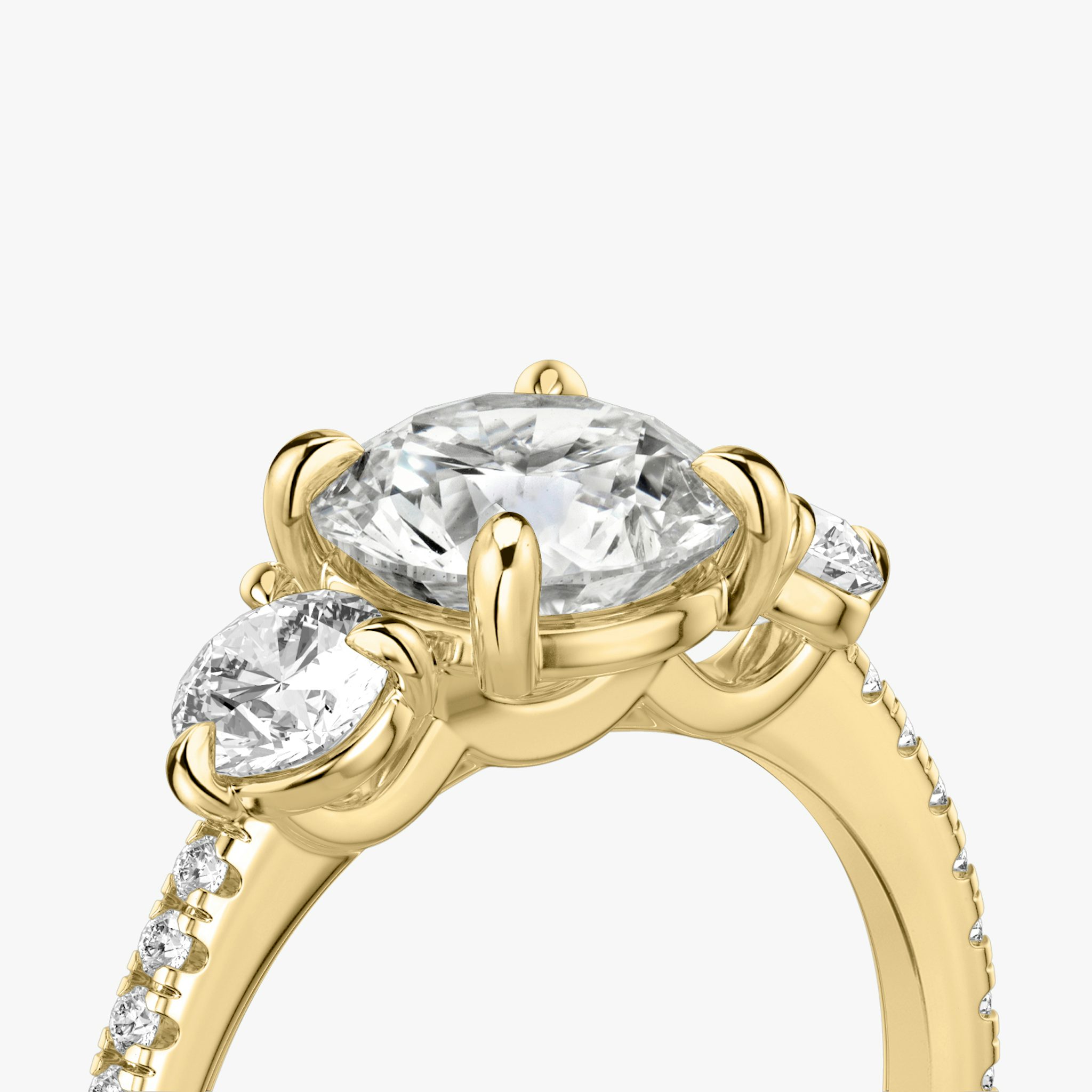 The Three Stone | Round Brilliant | 18k | Yellow Gold | bandAccent: Pavé | caratWeight: other | sideStoneCarat: 0.25ct | sideStoneShape: Round Brilliant | diamondOrientation: vertical