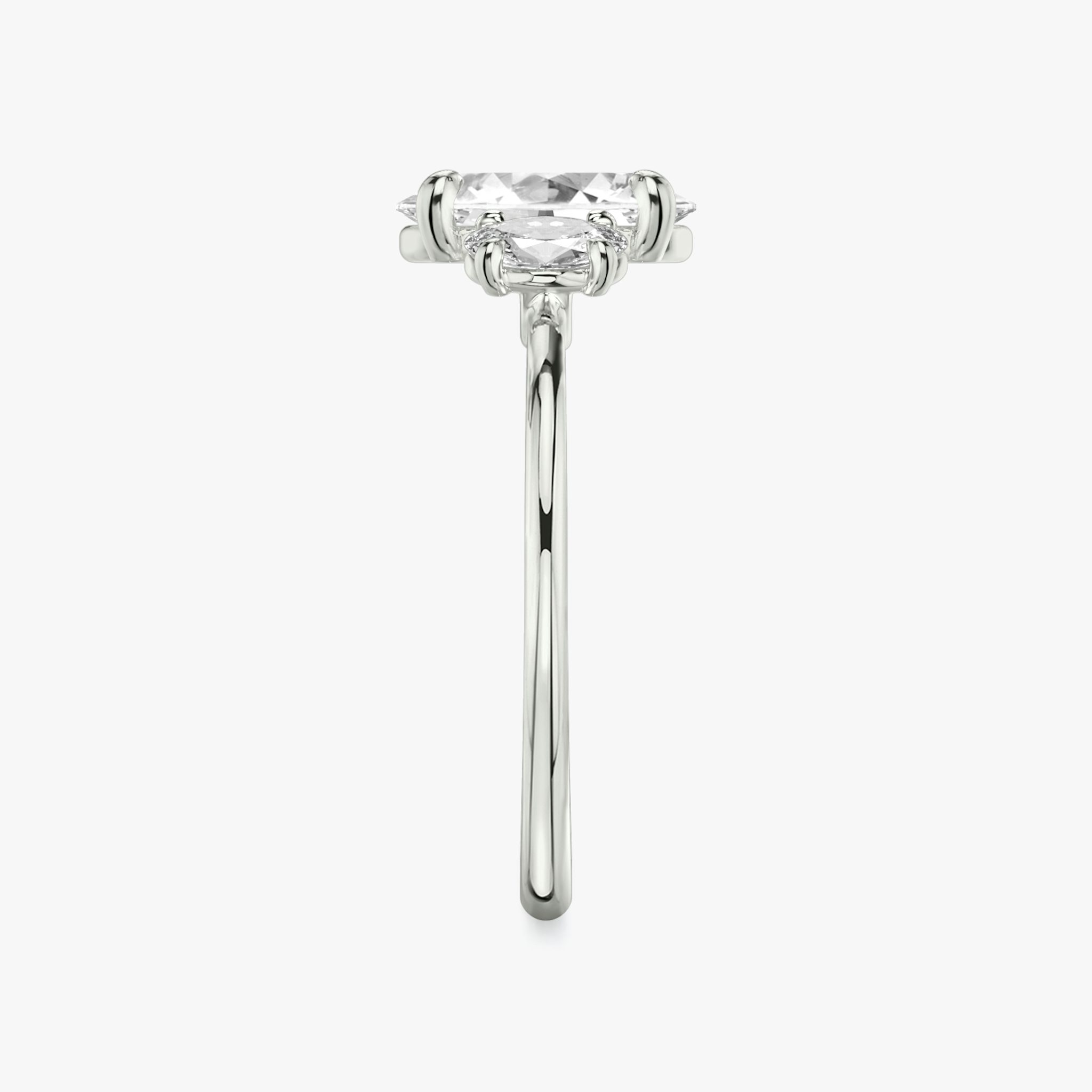The Three Stone | Oval | 18k | White Gold | bandAccent: Plain | sideStoneCarat: 0.25ct | sideStoneShape: Oval | diamondOrientation: vertical | caratWeight: other