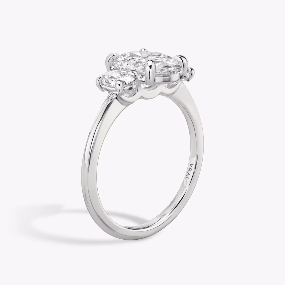 The Three Stone | Oval | 18k | White Gold | bandAccent: Plain | sideStoneCarat: 0.25ct | sideStoneShape: Oval | diamondOrientation: vertical | caratWeight: other