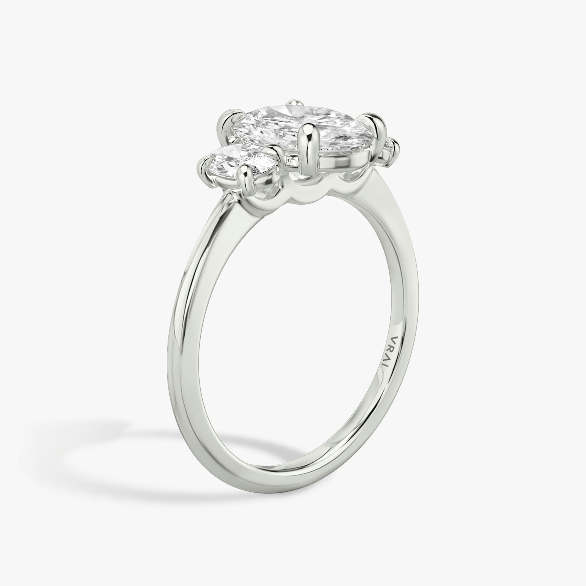 The Three Stone | Oval | 18k | White Gold | bandAccent: Plain | sideStoneCarat: 0.25ct | sideStoneShape: Oval | diamondOrientation: vertical | caratWeight: other