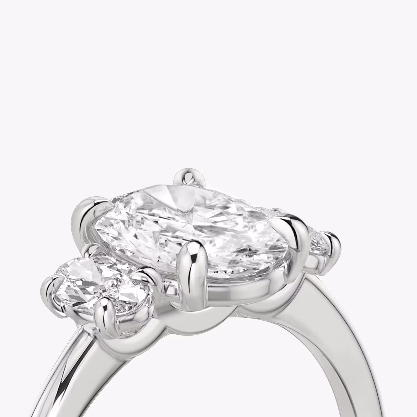 The Three Stone | Oval | 18k | White Gold | bandAccent: Plain | sideStoneCarat: 0.25ct | sideStoneShape: Oval | diamondOrientation: vertical | caratWeight: other