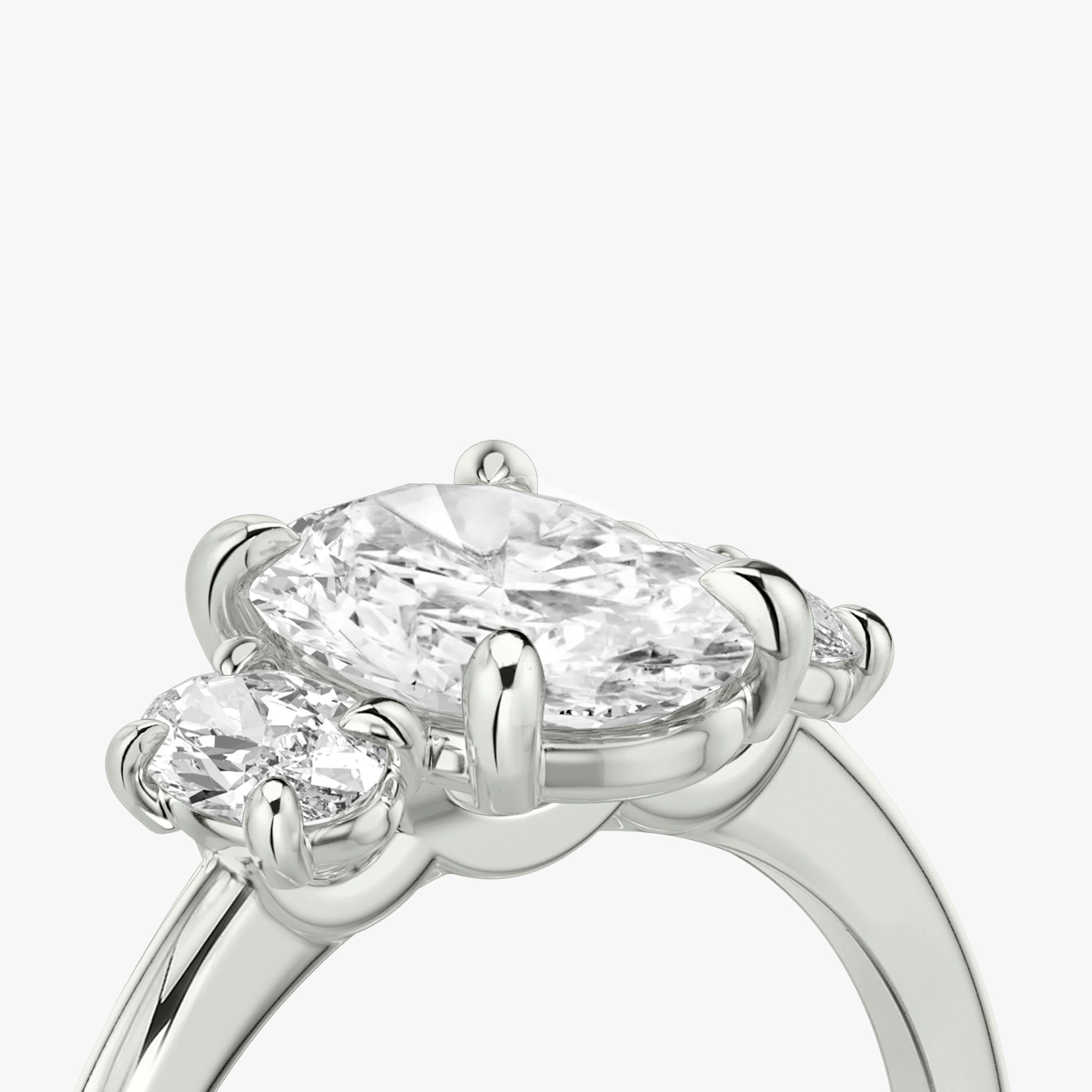 The Three Stone | Oval | Platinum | bandAccent: Plain | sideStoneCarat: 0.25ct | sideStoneShape: Oval | diamondOrientation: vertical | caratWeight: other