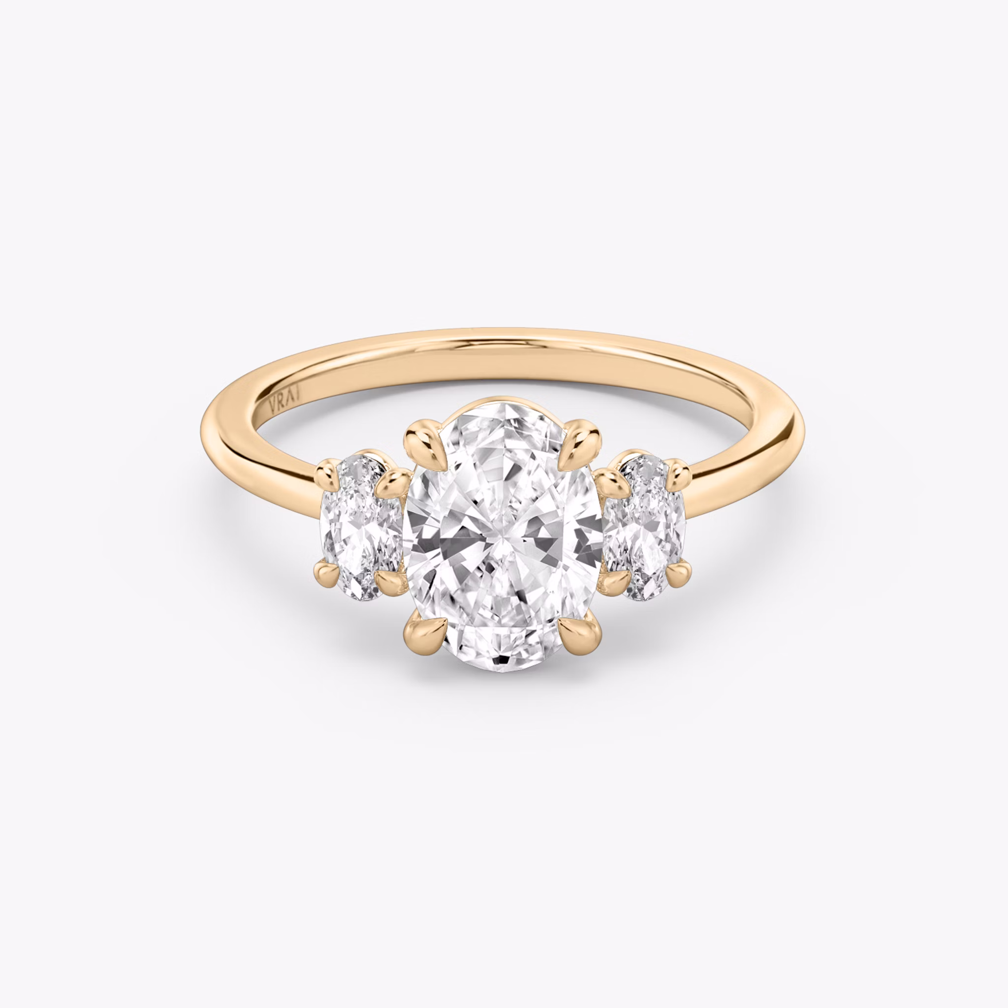 The Three Stone | Oval | 14k | Rose Gold | bandAccent: Plain | sideStoneCarat: 0.25ct | sideStoneShape: Oval | diamondOrientation: vertical | caratWeight: other