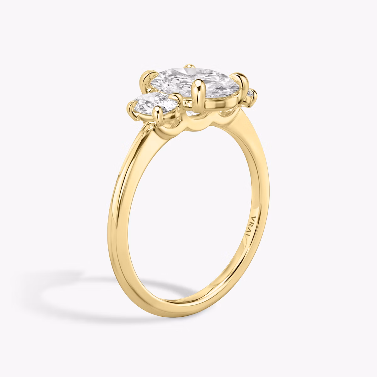 The Three Stone | Oval | 18k | Yellow Gold | bandAccent: Plain | sideStoneCarat: 0.25ct | sideStoneShape: Oval | diamondOrientation: vertical | caratWeight: other