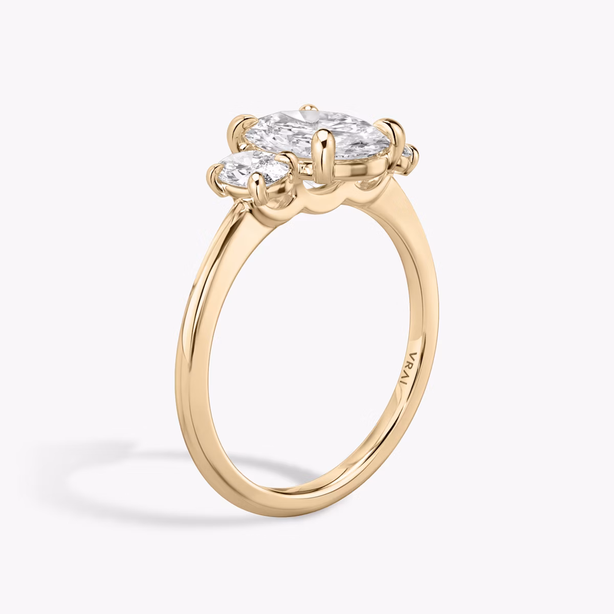 The Three Stone | Oval | 14k | Rose Gold | bandAccent: Plain | sideStoneCarat: 0.25ct | sideStoneShape: Oval | diamondOrientation: vertical | caratWeight: other
