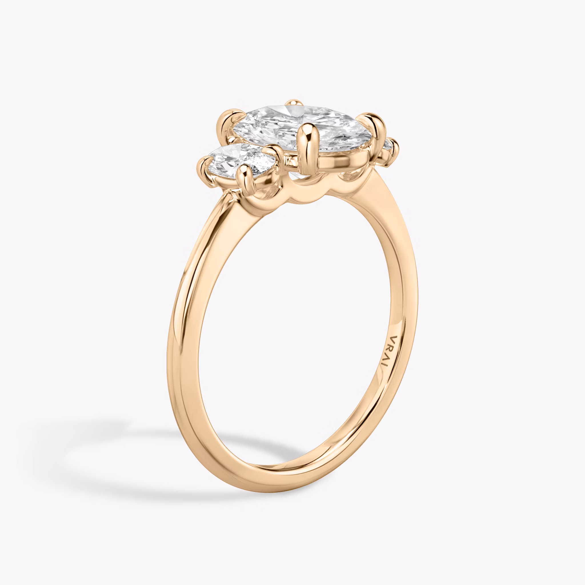 The Three Stone | Oval | 14k | Rose Gold | bandAccent: Plain | sideStoneCarat: 0.25ct | sideStoneShape: Oval | diamondOrientation: vertical | caratWeight: other