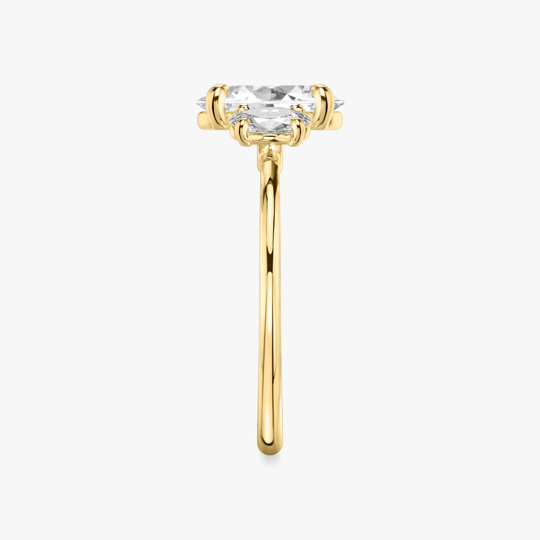 The Three Stone | Oval | 18k | Yellow Gold | bandAccent: Plain | sideStoneCarat: 0.25ct | sideStoneShape: Oval | diamondOrientation: vertical | caratWeight: other