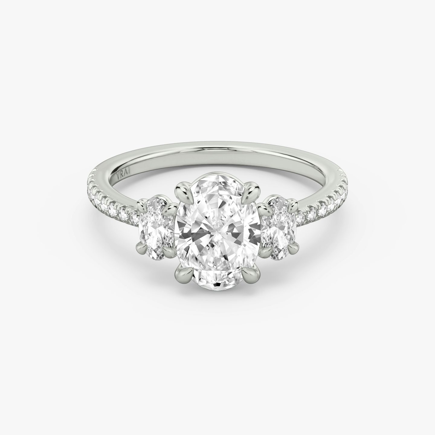 The Three Stone | Oval | Platinum | bandAccent: Pavé | sideStoneCarat: 0.25ct | sideStoneShape: Oval | diamondOrientation: vertical | caratWeight: other