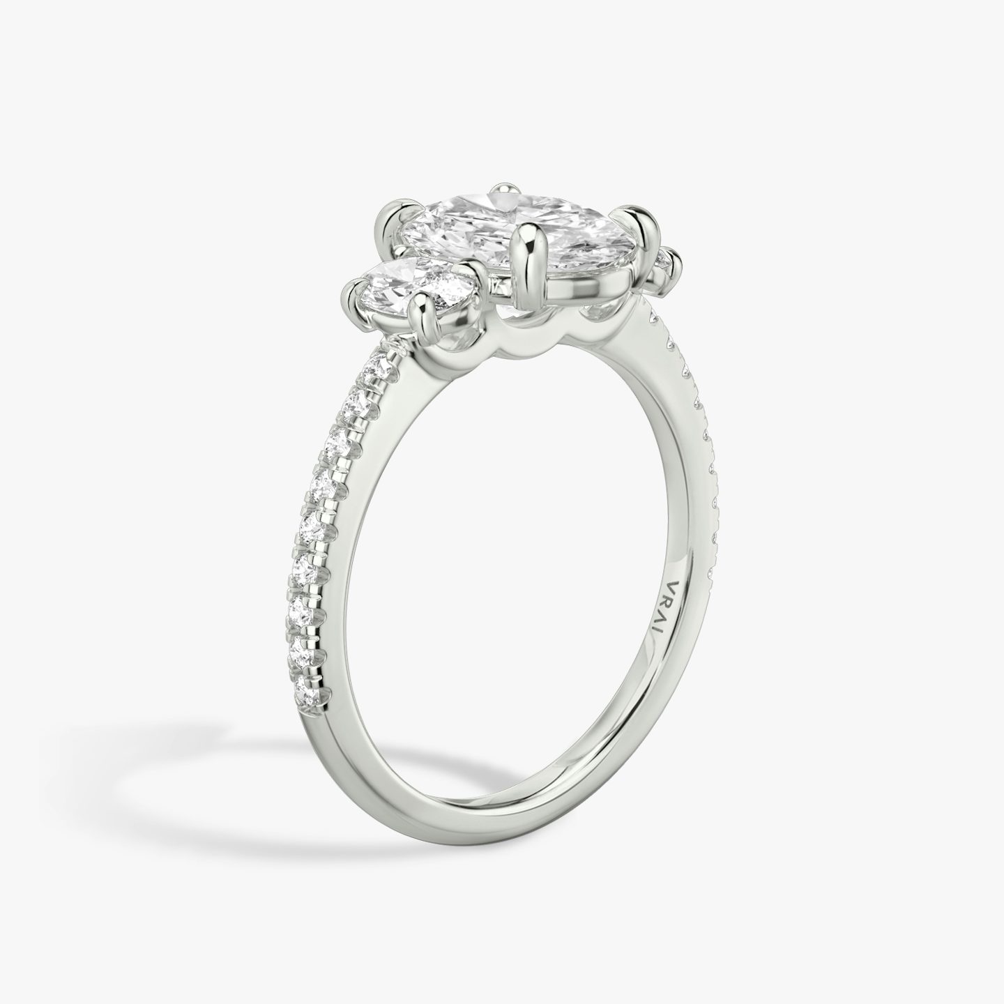The Three Stone | Oval | 18k | White Gold | bandAccent: Pavé | sideStoneCarat: 0.25ct | sideStoneShape: Oval | diamondOrientation: vertical | caratWeight: other
