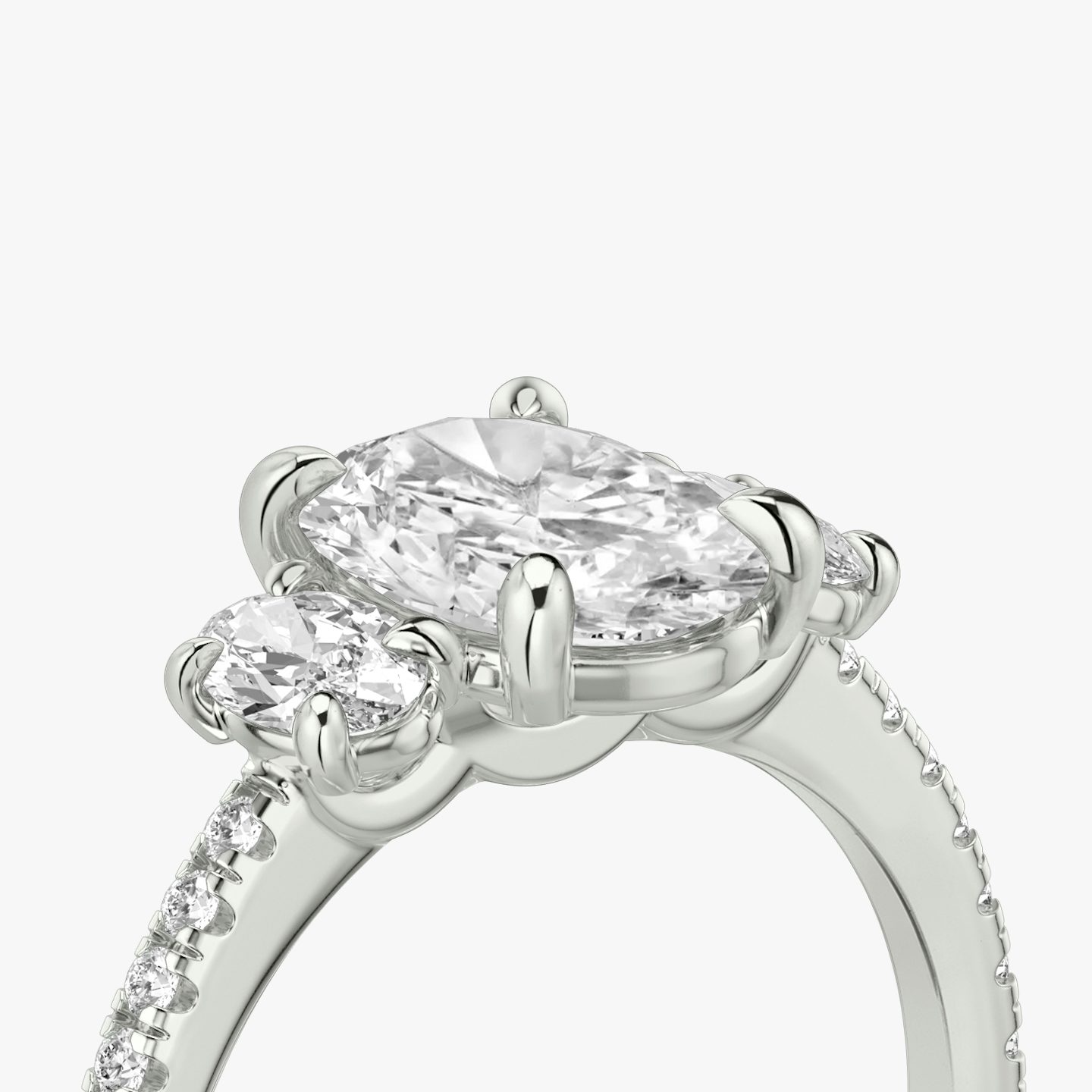 The Three Stone | Oval | 18k | White Gold | bandAccent: Pavé | sideStoneCarat: 0.25ct | sideStoneShape: Oval | diamondOrientation: vertical | caratWeight: other