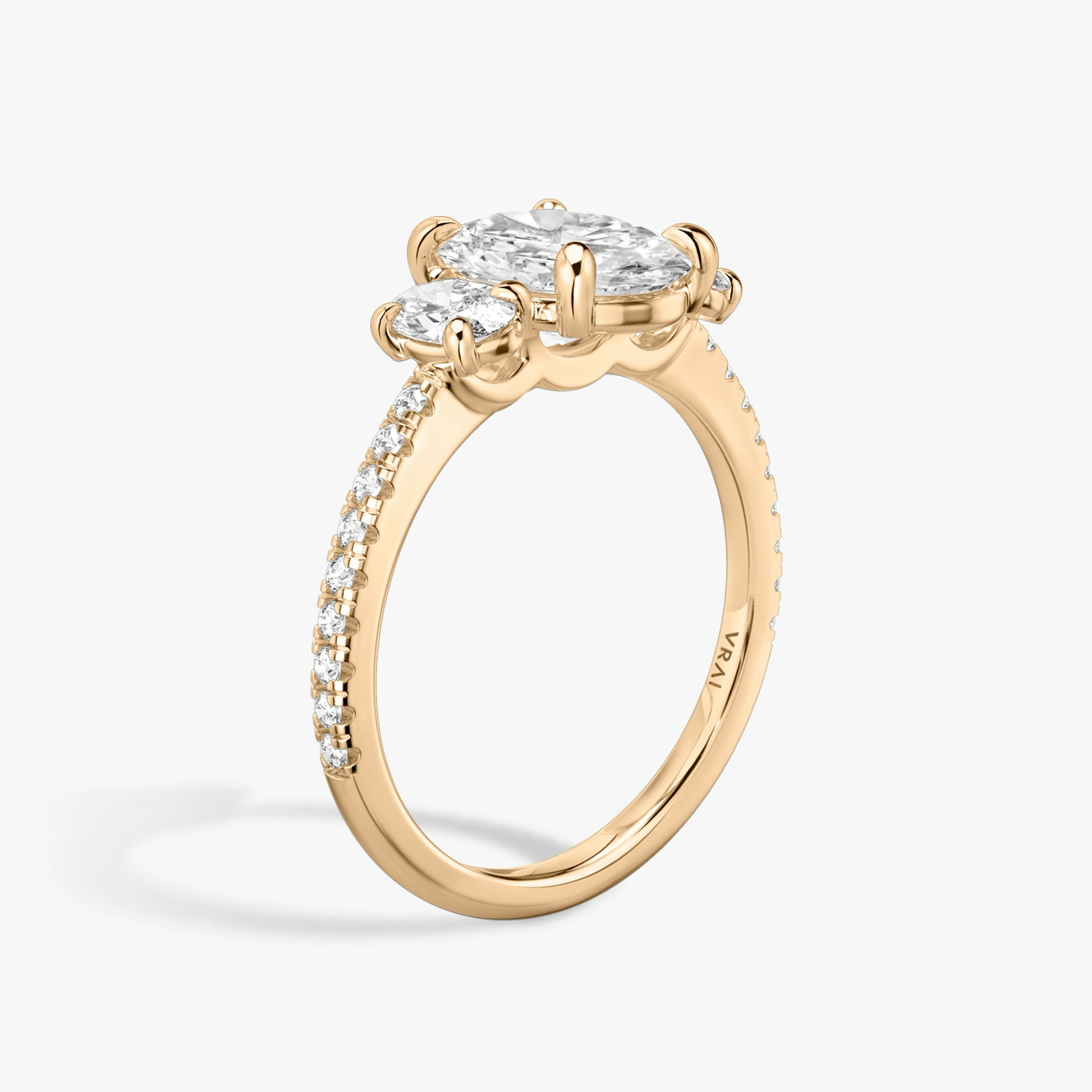 The Three Stone | Oval | 14k | Rose Gold | bandAccent: Pavé | sideStoneCarat: 0.25ct | sideStoneShape: Oval | diamondOrientation: vertical | caratWeight: other