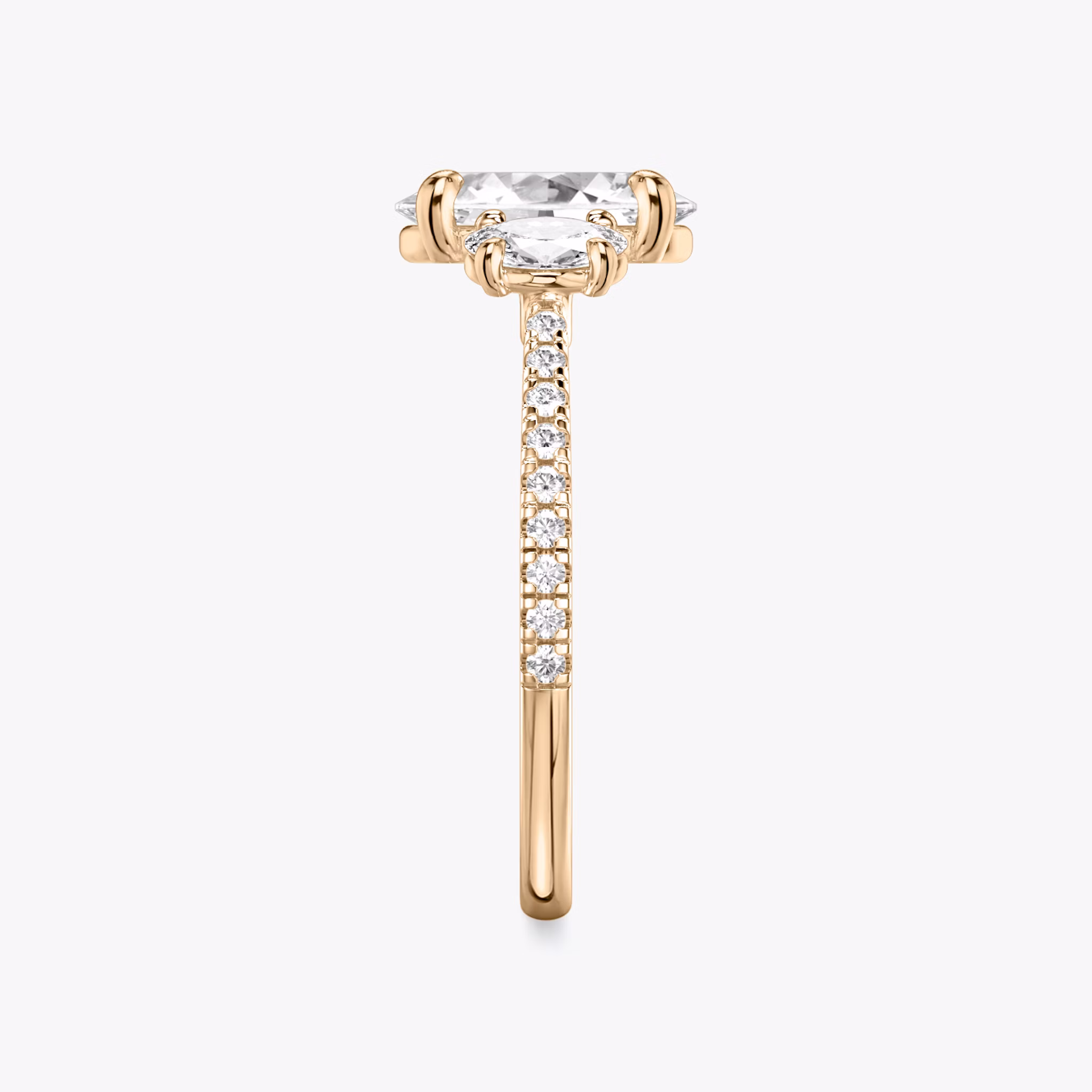The Three Stone | Oval | 14k | Rose Gold | bandAccent: Pavé | sideStoneCarat: 0.25ct | sideStoneShape: Oval | diamondOrientation: vertical | caratWeight: other