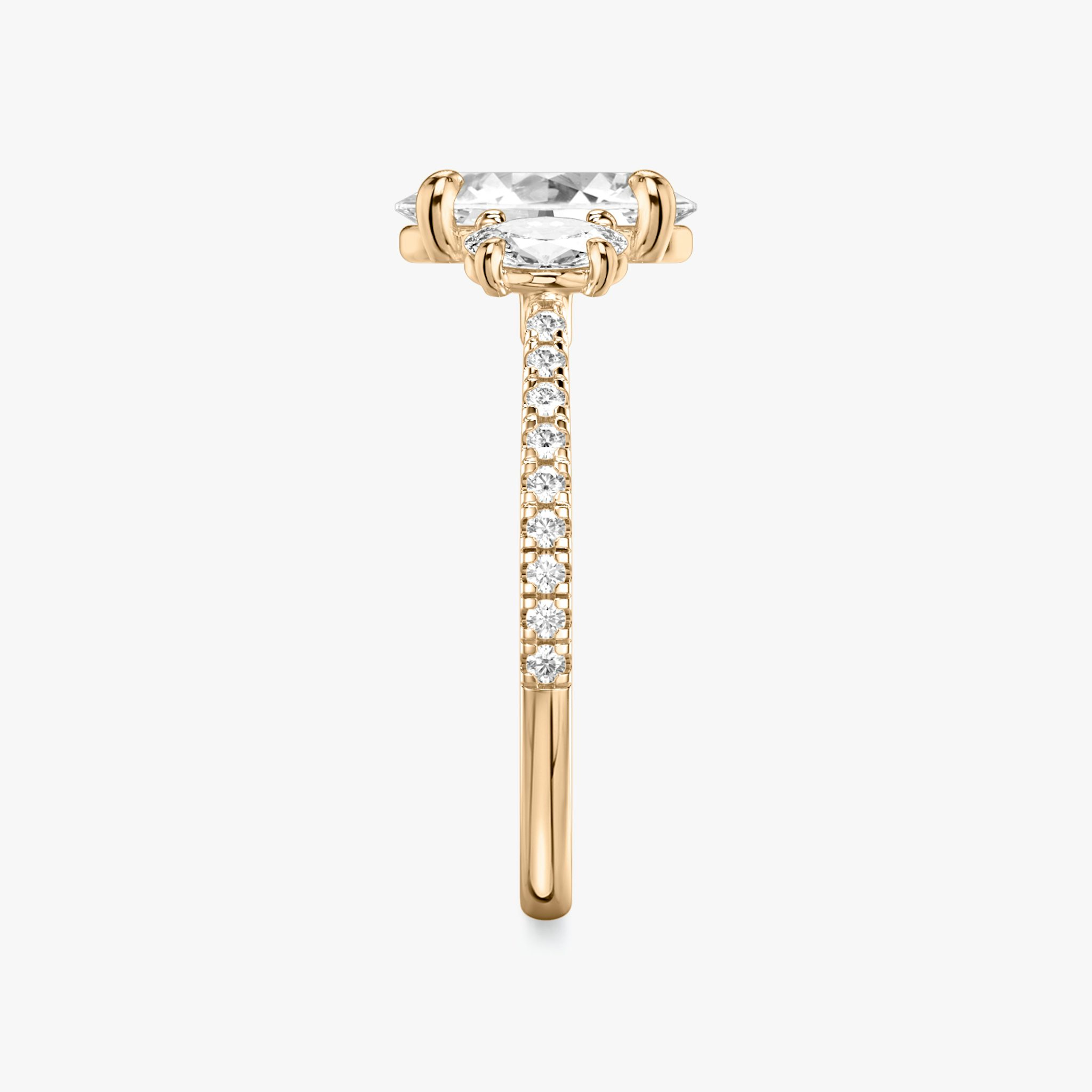 The Three Stone | Oval | 14k | Rose Gold | bandAccent: Pavé | sideStoneCarat: 0.25ct | sideStoneShape: Oval | diamondOrientation: vertical | caratWeight: other