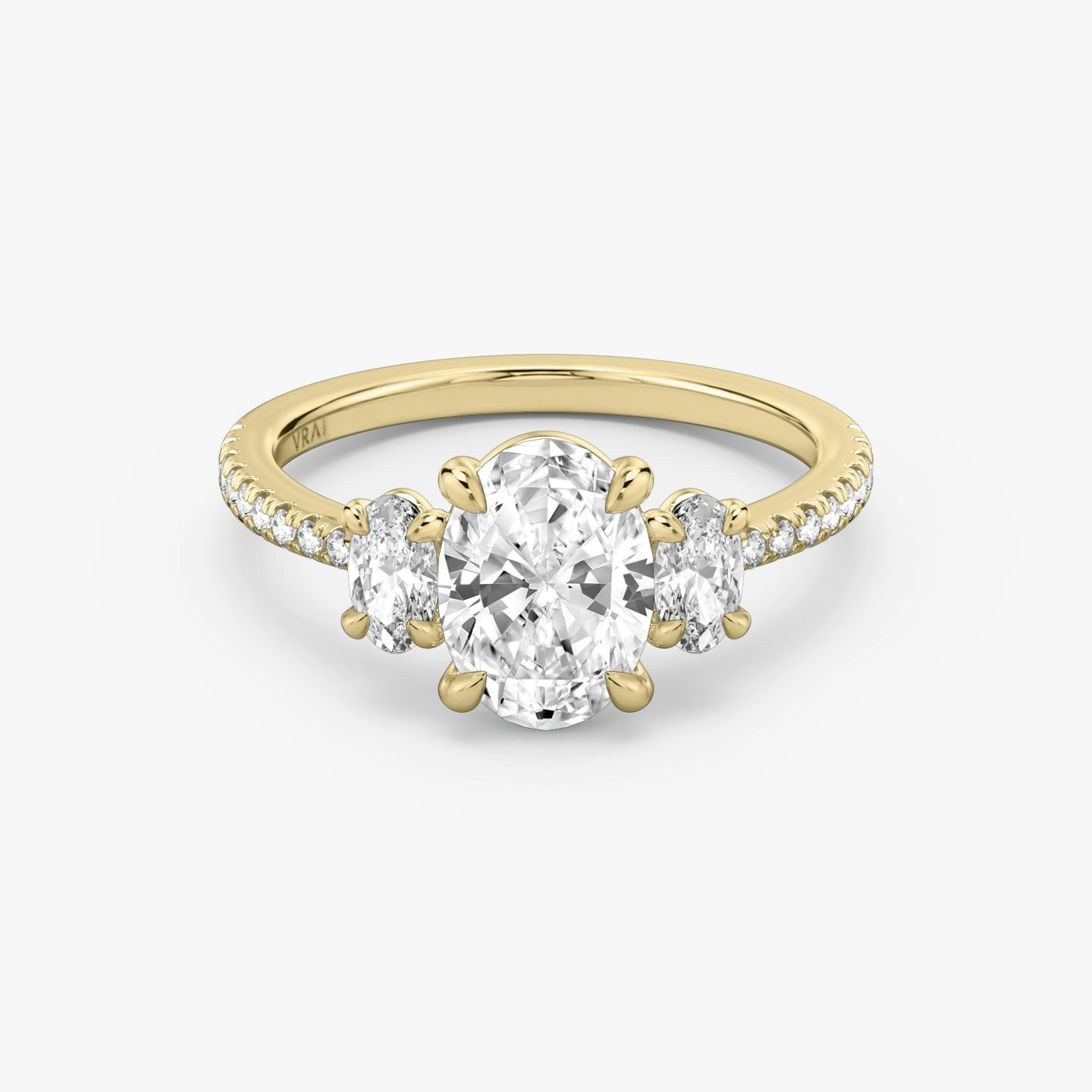 The Three Stone | Oval | 18k | Yellow Gold | bandAccent: Pavé | sideStoneCarat: 0.25ct | sideStoneShape: Oval | diamondOrientation: vertical | caratWeight: other