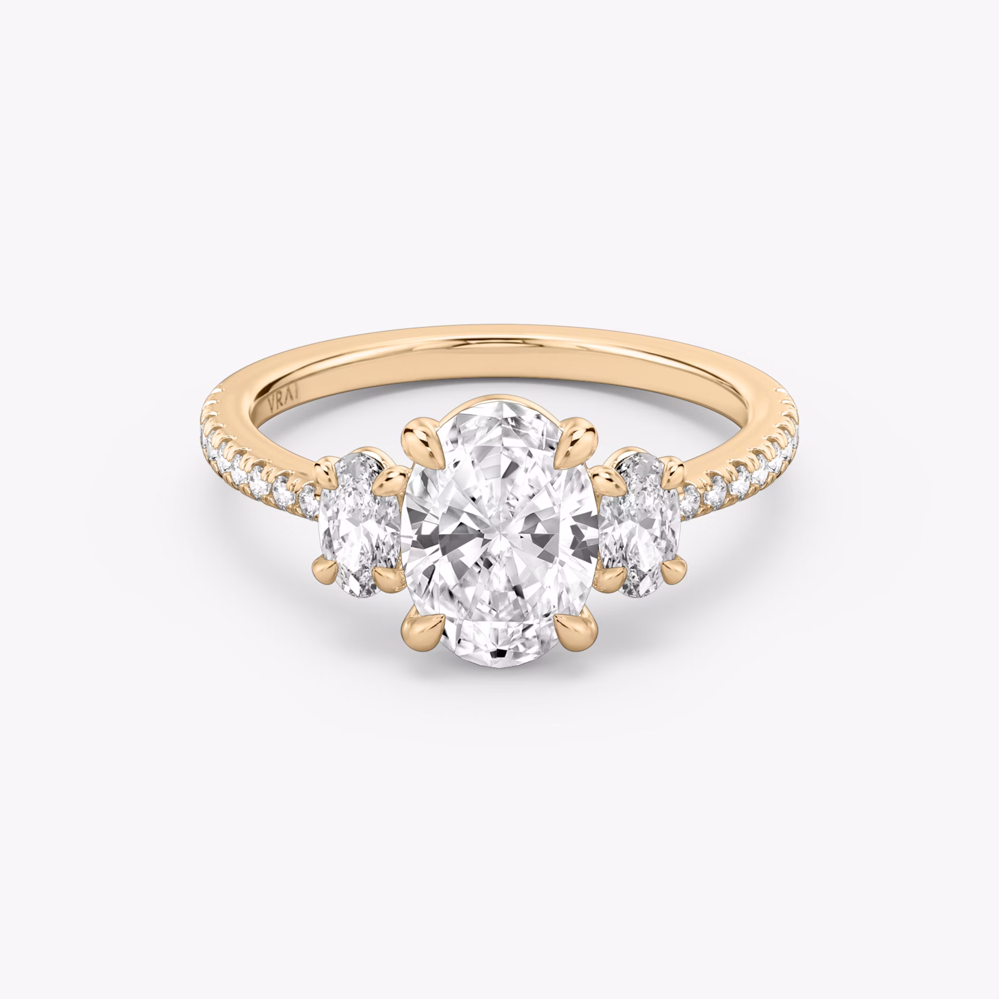 The Three Stone | Oval | 14k | Rose Gold | bandAccent: Pavé | sideStoneCarat: 0.25ct | sideStoneShape: Oval | diamondOrientation: vertical | caratWeight: other
