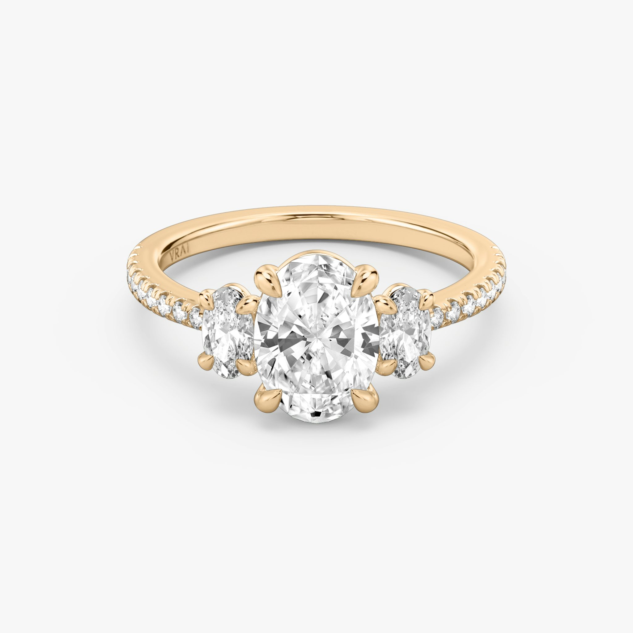 The Three Stone | Oval | 14k | Rose Gold | bandAccent: Pavé | sideStoneCarat: 0.25ct | sideStoneShape: Oval | diamondOrientation: vertical | caratWeight: other