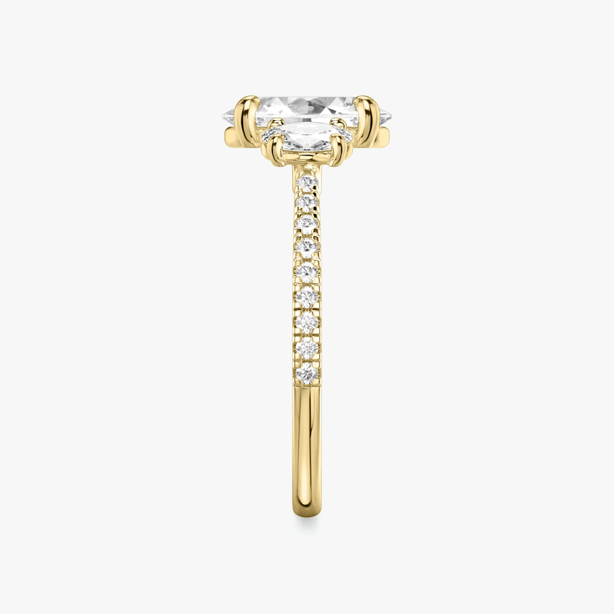 The Three Stone | Oval | 18k | Yellow Gold | bandAccent: Pavé | sideStoneCarat: 0.25ct | sideStoneShape: Oval | diamondOrientation: vertical | caratWeight: other