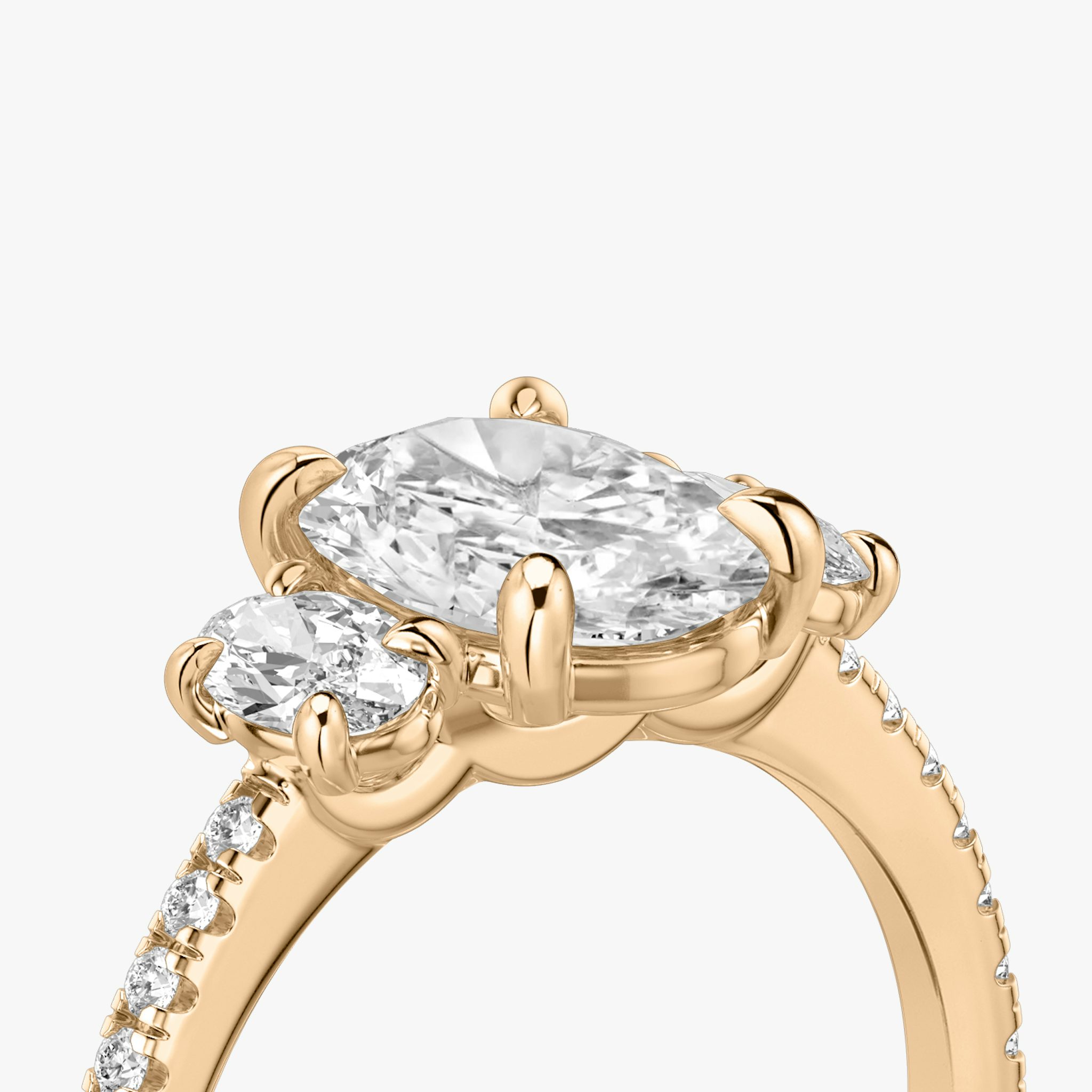 The Three Stone | Oval | 14k | Rose Gold | bandAccent: Pavé | sideStoneCarat: 0.25ct | sideStoneShape: Oval | diamondOrientation: vertical | caratWeight: other