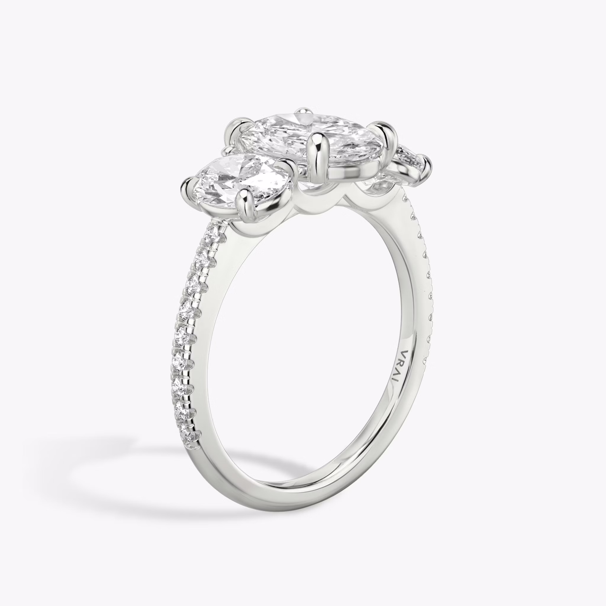The Three Stone | Oval | 18k | White Gold | bandAccent: Pavé | sideStoneCarat: 0.50ct | sideStoneShape: Oval | diamondOrientation: vertical | caratWeight: other