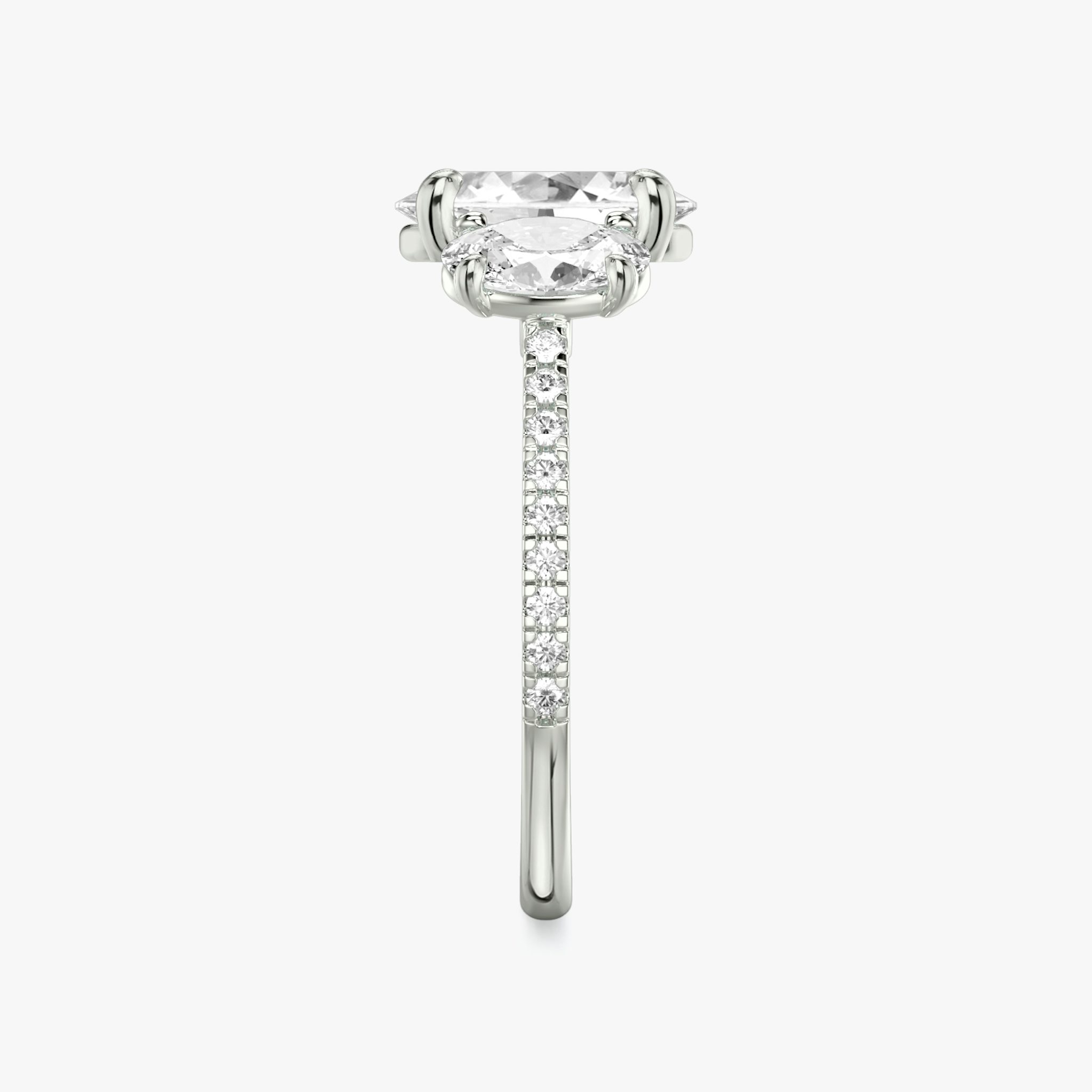 The Three Stone | Oval | 18k | White Gold | bandAccent: Pavé | sideStoneCarat: 0.50ct | sideStoneShape: Oval | diamondOrientation: vertical | caratWeight: other