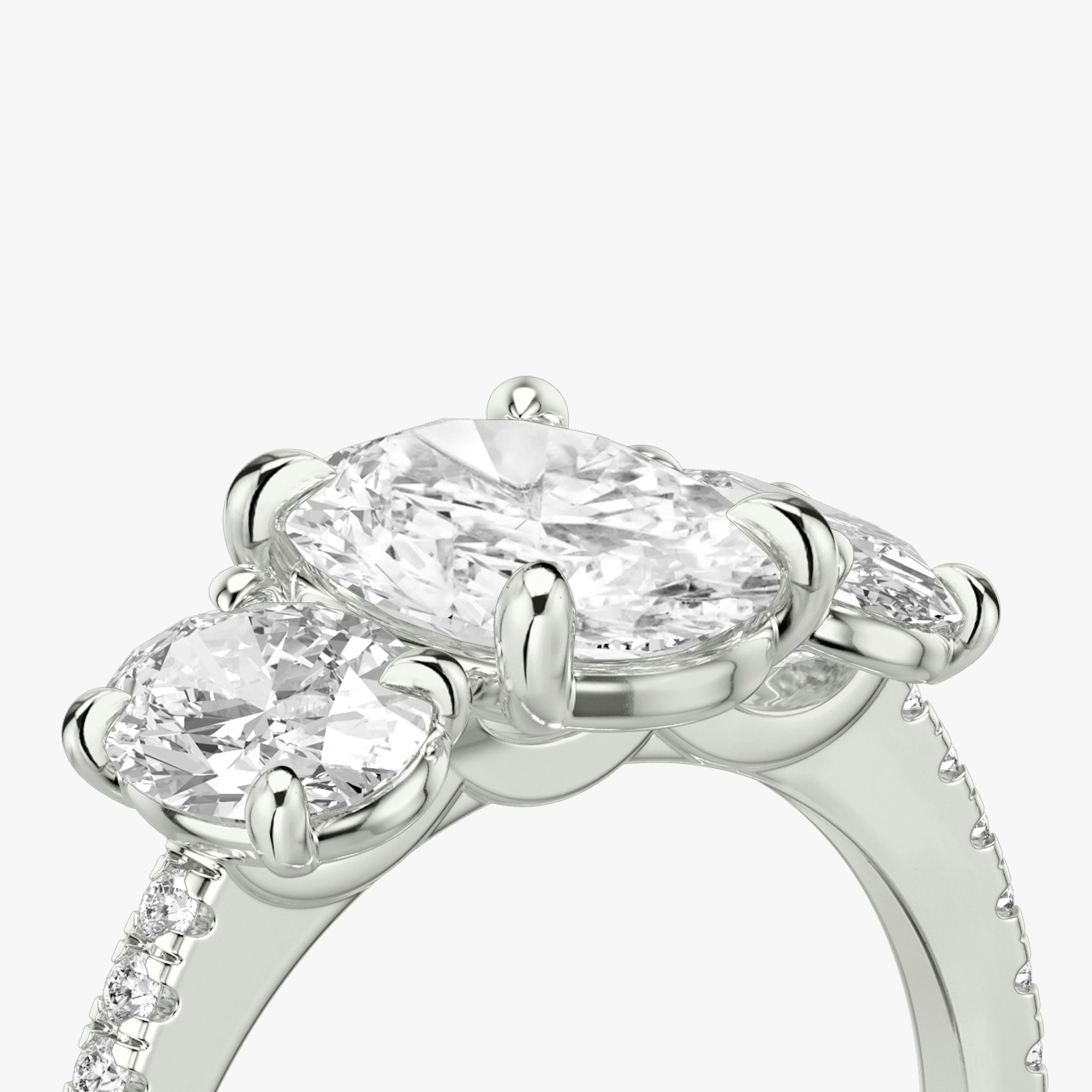 The Three Stone | Oval | 18k | White Gold | bandAccent: Pavé | sideStoneCarat: 0.50ct | sideStoneShape: Oval | diamondOrientation: vertical | caratWeight: other