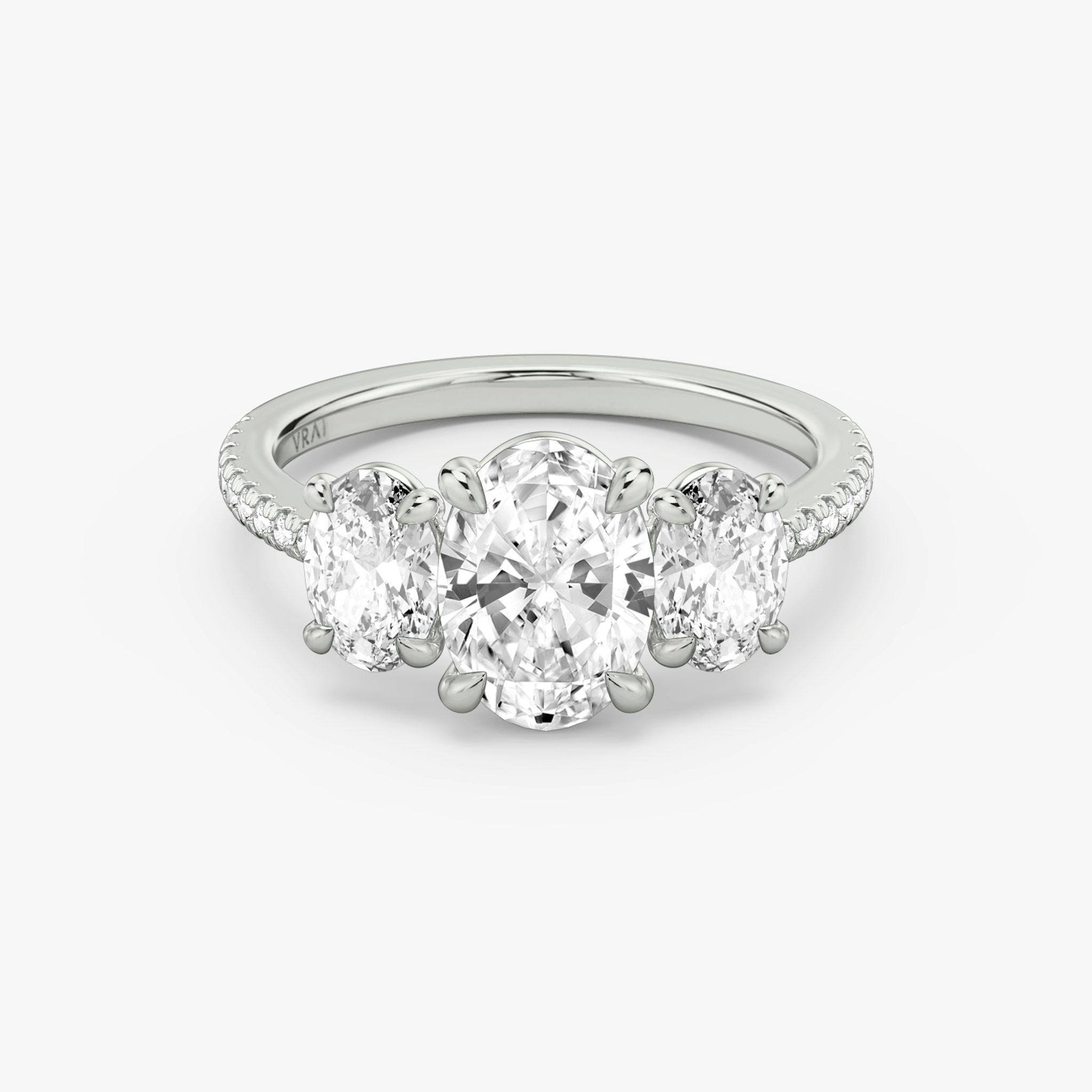 The Three Stone | Oval | 18k | White Gold | bandAccent: Pavé | sideStoneCarat: 0.50ct | sideStoneShape: Oval | diamondOrientation: vertical | caratWeight: other