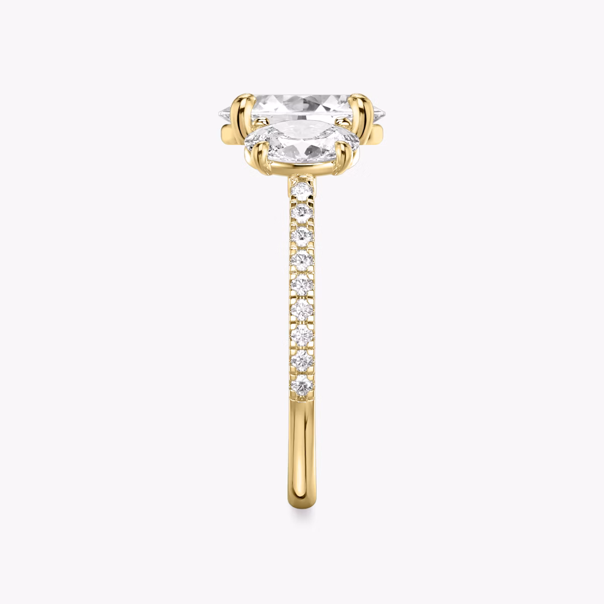 The Three Stone | Oval | 18k | Yellow Gold | bandAccent: Pavé | sideStoneCarat: 0.50ct | sideStoneShape: Oval | diamondOrientation: vertical | caratWeight: other