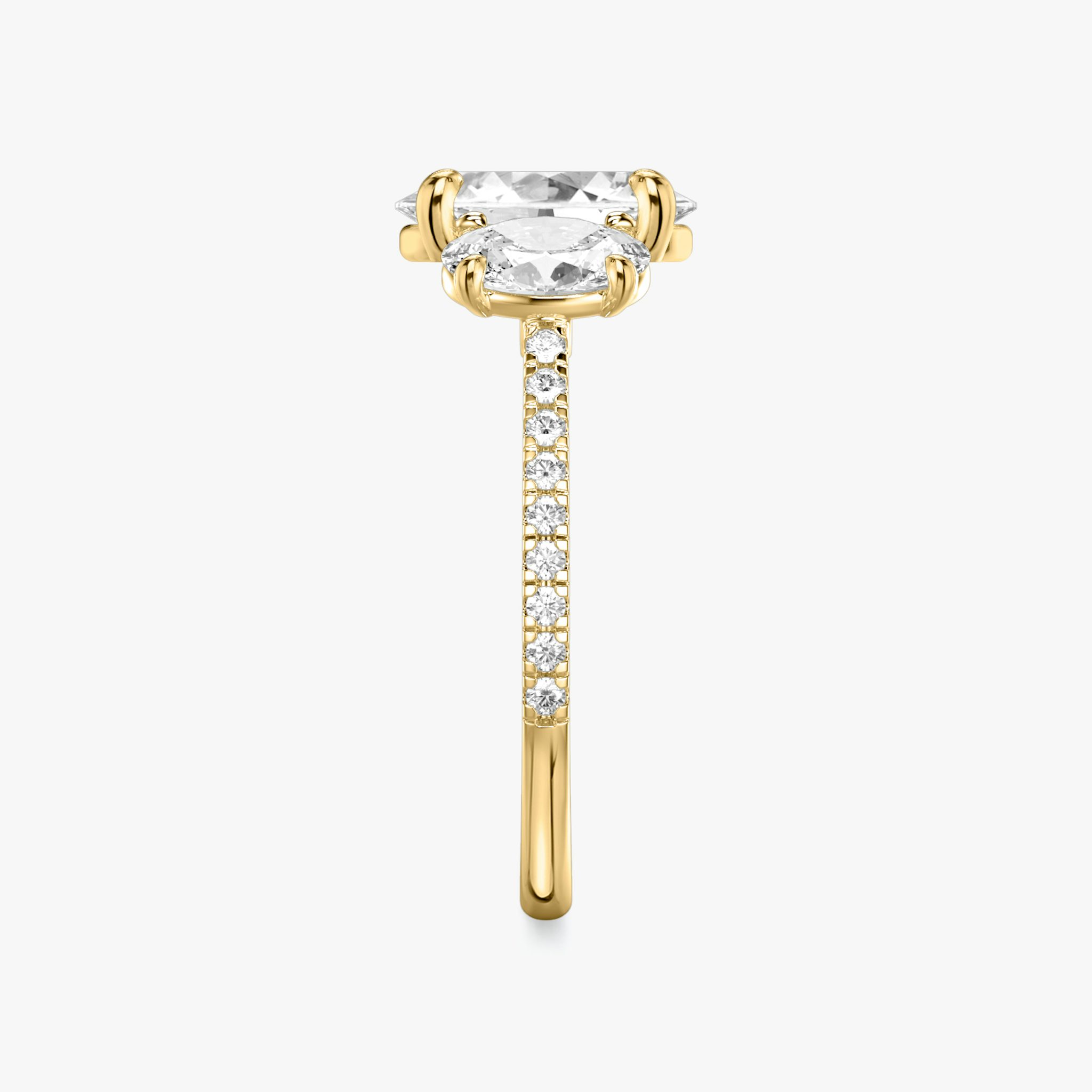 The Three Stone | Oval | 18k | Yellow Gold | bandAccent: Pavé | sideStoneCarat: 0.50ct | sideStoneShape: Oval | diamondOrientation: vertical | caratWeight: other