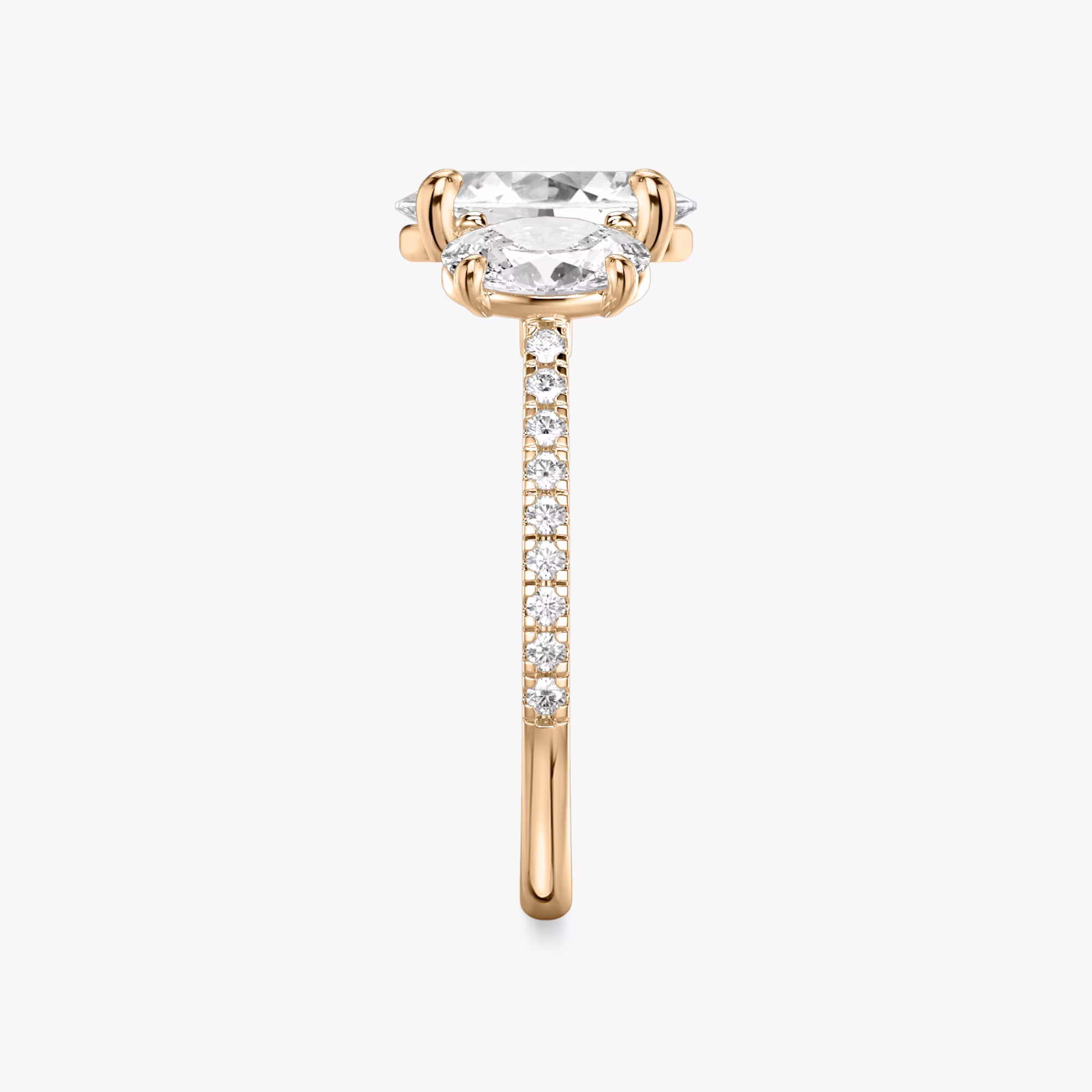 The Three Stone | Oval | 14k | Rose Gold | bandAccent: Pavé | sideStoneCarat: 0.50ct | sideStoneShape: Oval | diamondOrientation: vertical | caratWeight: other