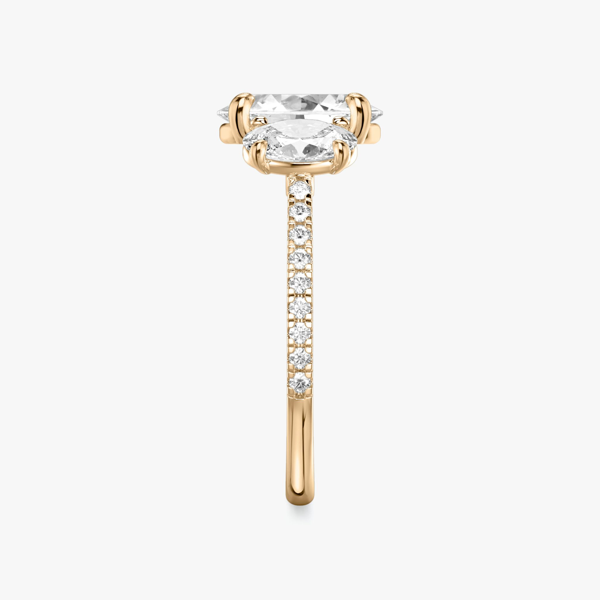 The Three Stone | Oval | 14k | Rose Gold | bandAccent: Pavé | sideStoneCarat: 0.50ct | sideStoneShape: Oval | diamondOrientation: vertical | caratWeight: other