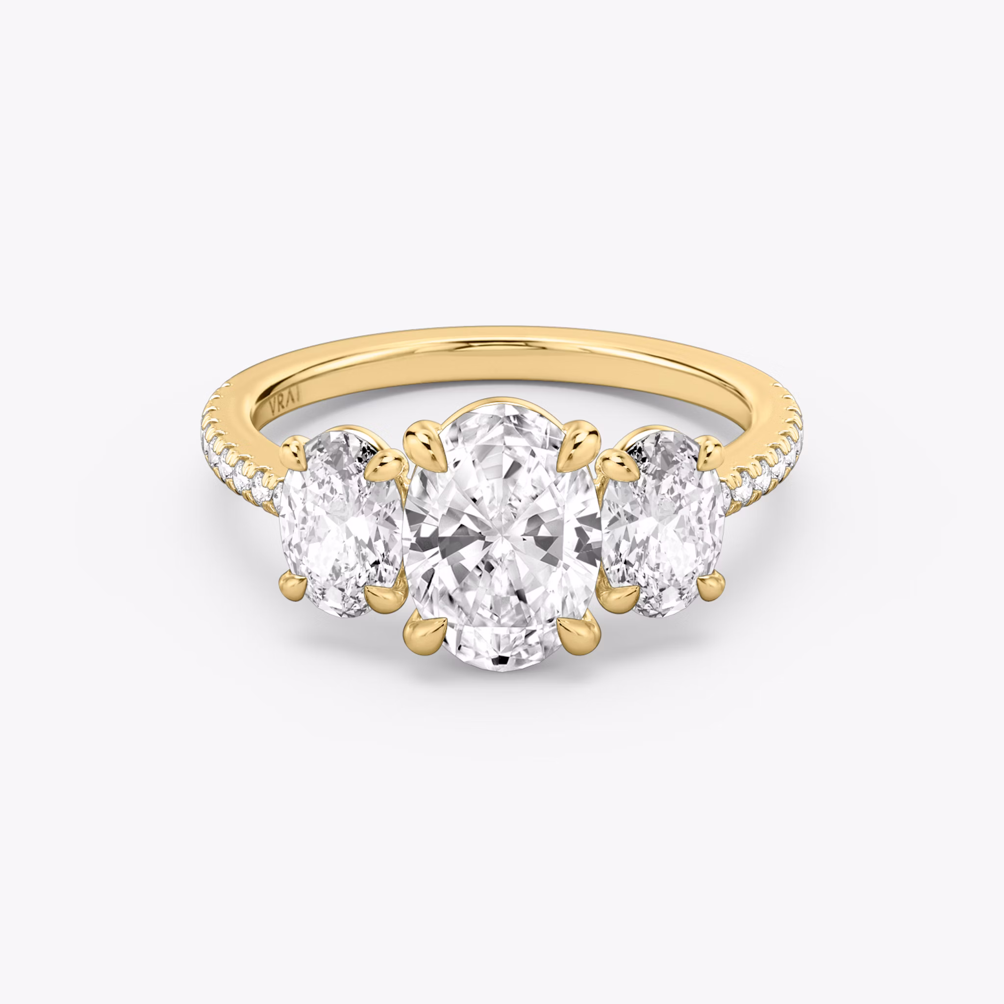 The Three Stone | Oval | 18k | Yellow Gold | bandAccent: Pavé | sideStoneCarat: 0.50ct | sideStoneShape: Oval | diamondOrientation: vertical | caratWeight: other