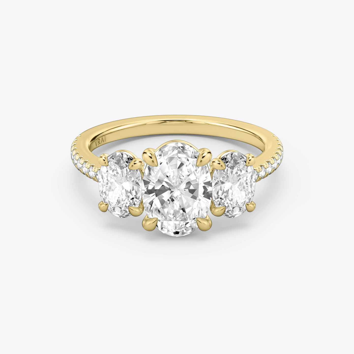 The Three Stone | Oval | 18k | Yellow Gold | bandAccent: Pavé | sideStoneCarat: 0.50ct | sideStoneShape: Oval | diamondOrientation: vertical | caratWeight: other