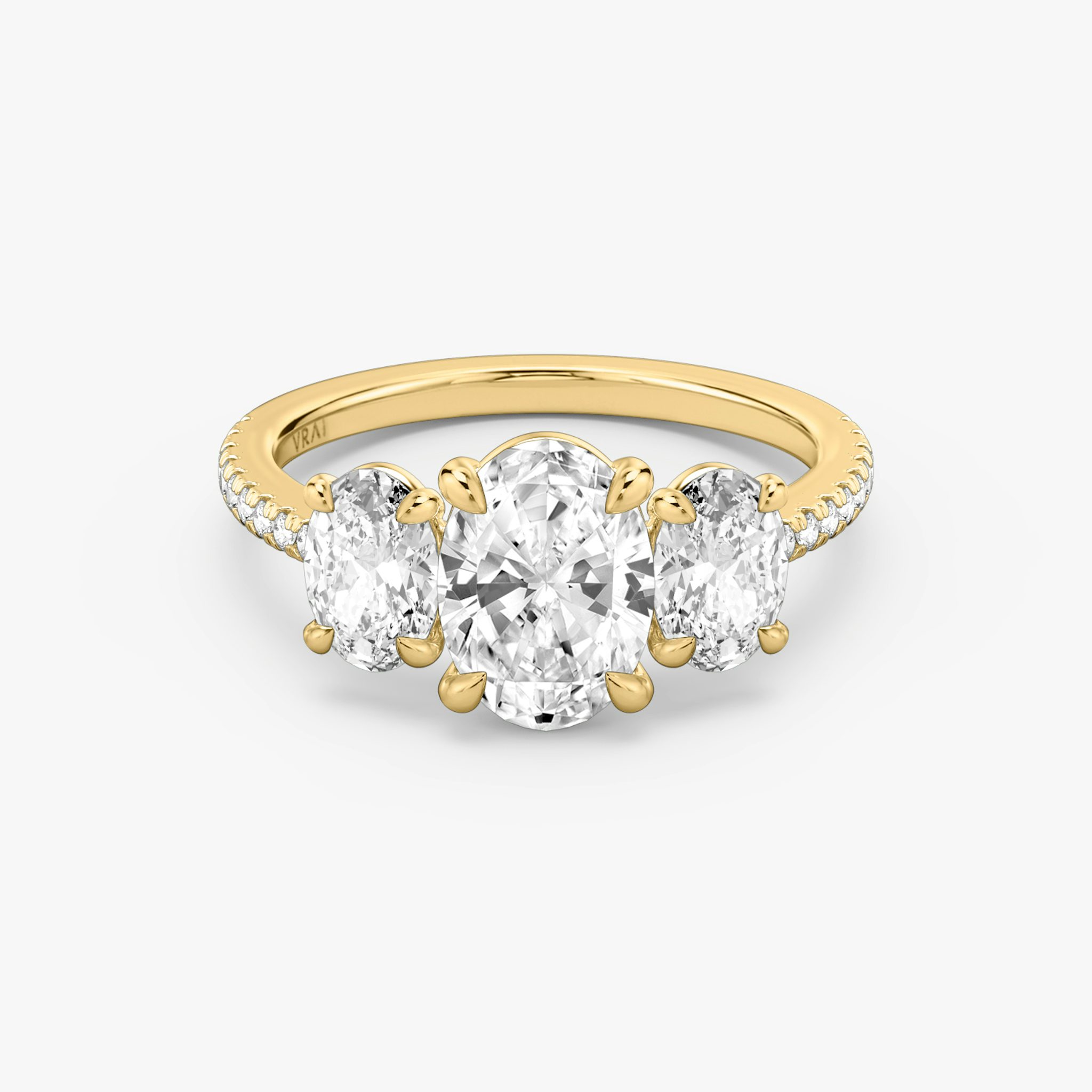 The Three Stone | Oval | 18k | Yellow Gold | bandAccent: Pavé | sideStoneCarat: 0.50ct | sideStoneShape: Oval | diamondOrientation: vertical | caratWeight: other