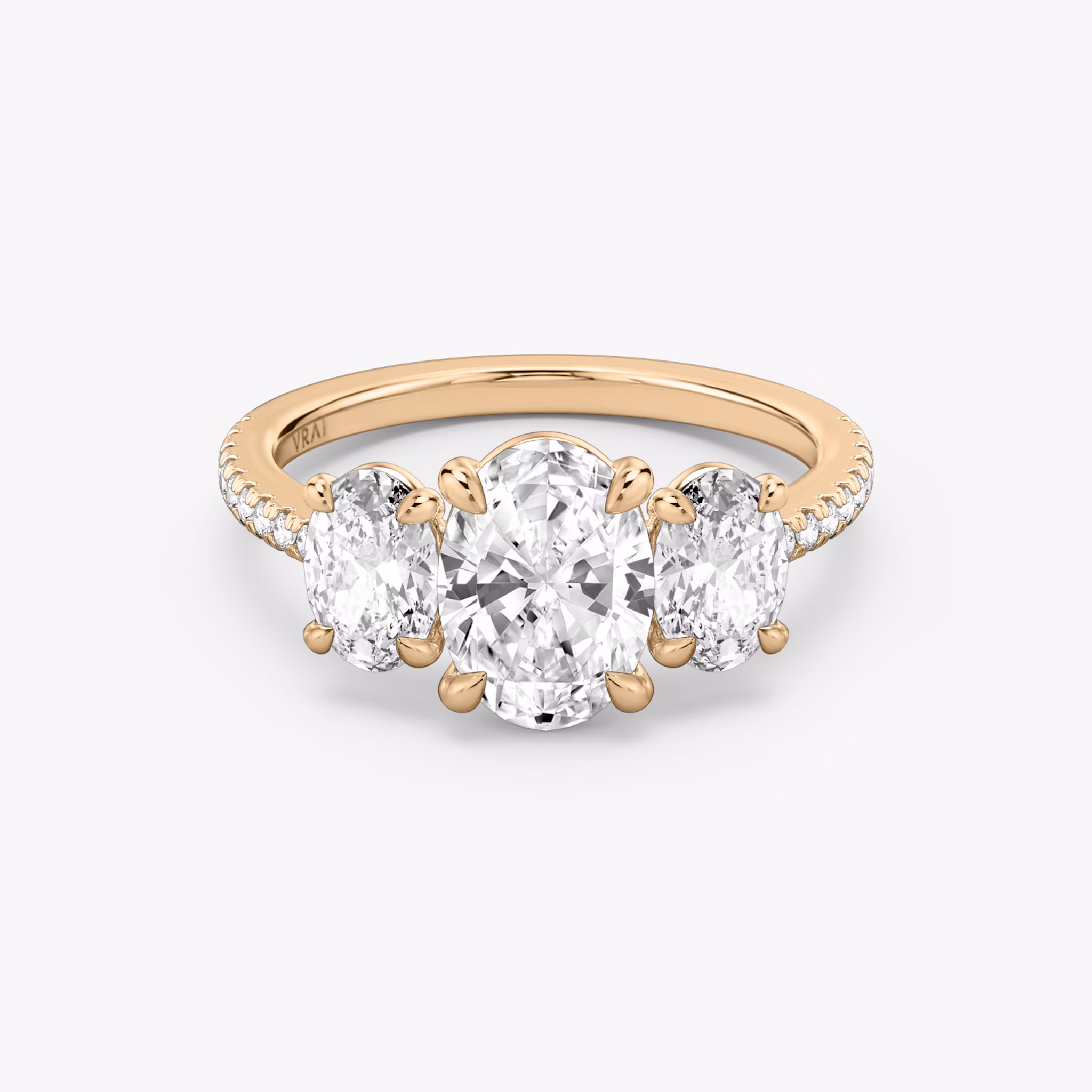 The Three Stone | Oval | 14k | Rose Gold | bandAccent: Pavé | sideStoneCarat: 0.50ct | sideStoneShape: Oval | diamondOrientation: vertical | caratWeight: other