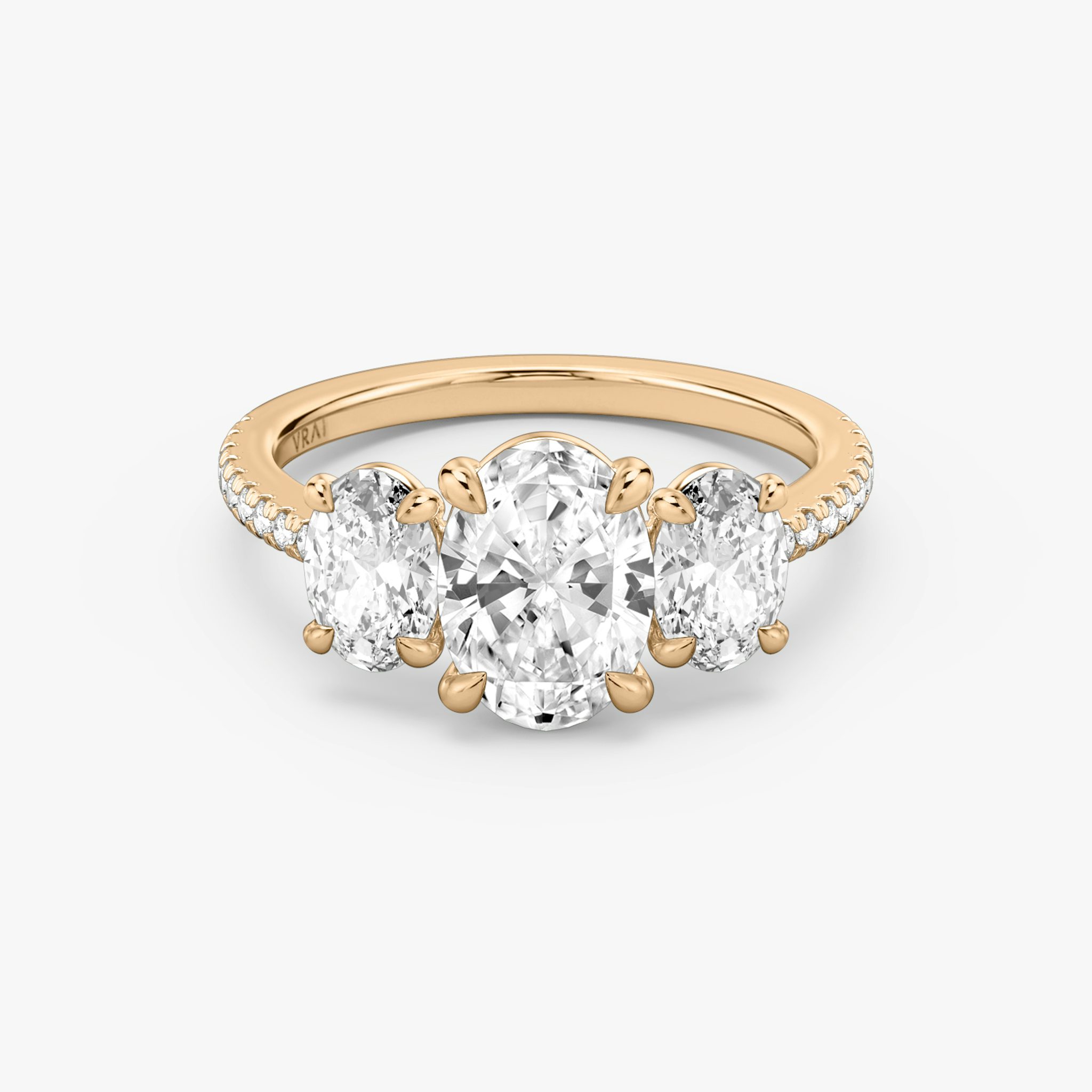 The Three Stone | Oval | 14k | Rose Gold | bandAccent: Pavé | sideStoneCarat: 0.50ct | sideStoneShape: Oval | diamondOrientation: vertical | caratWeight: other