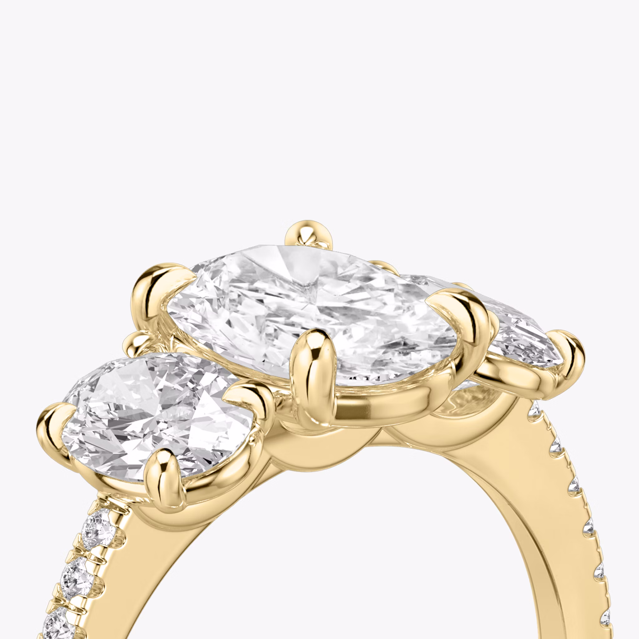 The Three Stone | Oval | 18k | Yellow Gold | bandAccent: Pavé | sideStoneCarat: 0.50ct | sideStoneShape: Oval | diamondOrientation: vertical | caratWeight: other