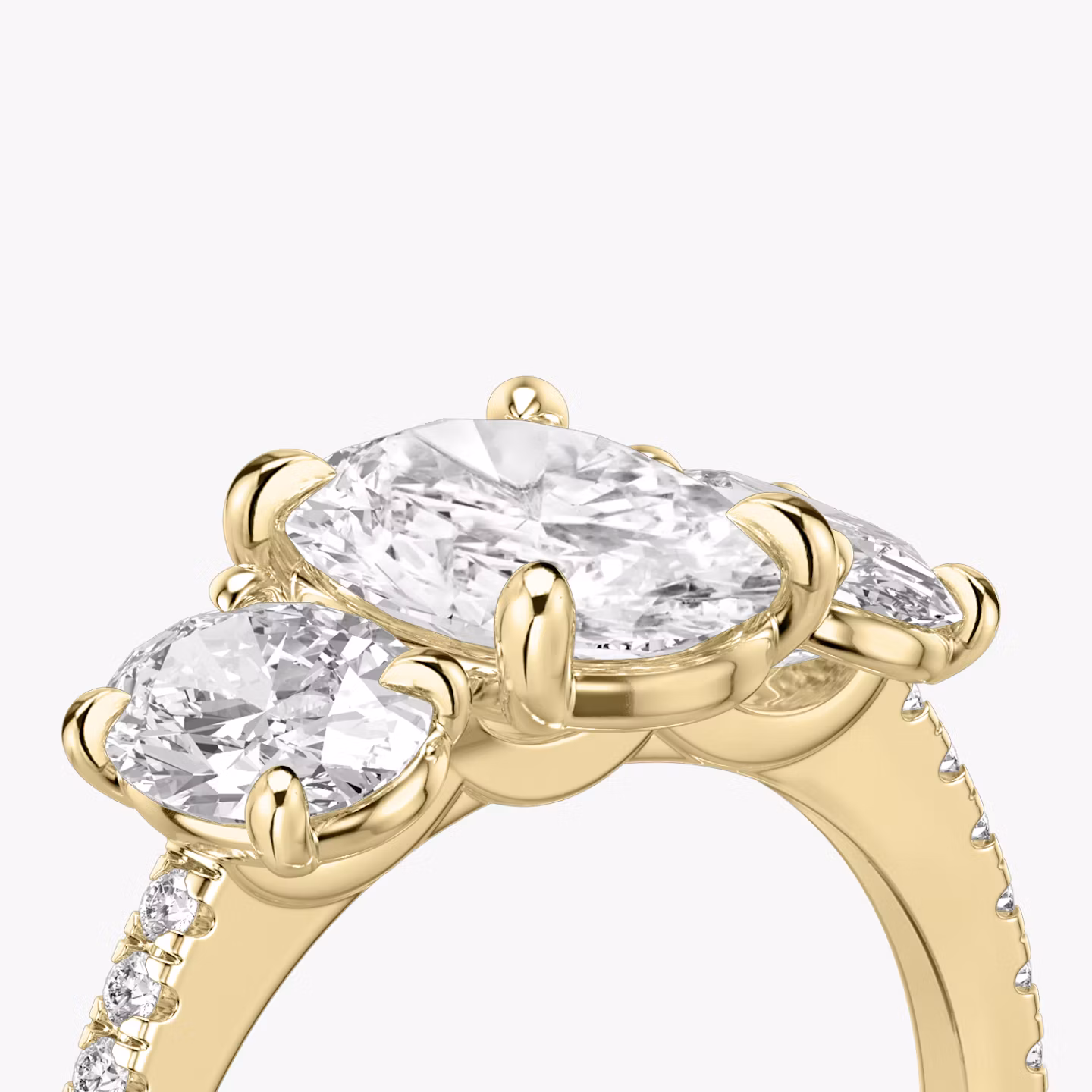 The Three Stone | Oval | 18k | Yellow Gold | bandAccent: Pavé | sideStoneCarat: 0.50ct | sideStoneShape: Oval | diamondOrientation: vertical | caratWeight: other