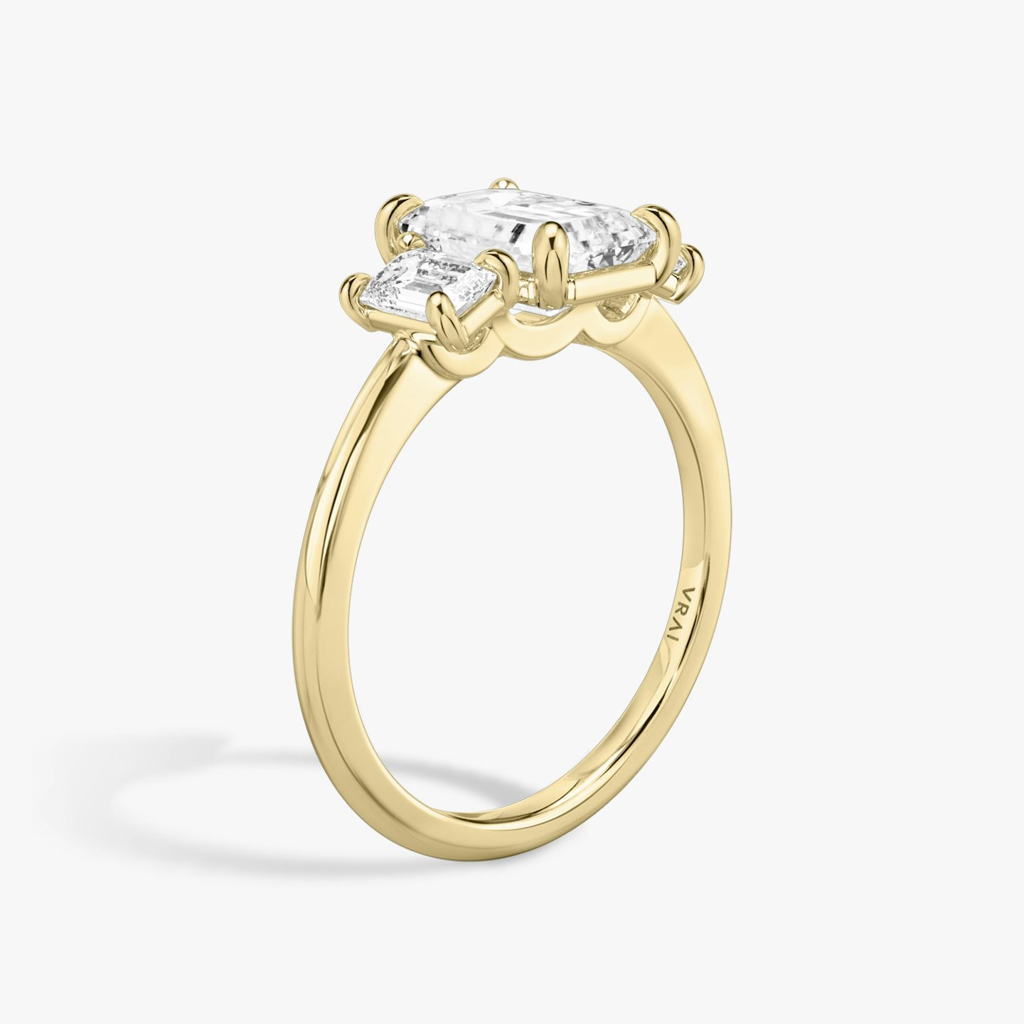 The Three Stone | Emerald | 18k | Yellow Gold | bandAccent: Plain | sideStoneCarat: 0.25ct | sideStoneShape: Emerald | diamondOrientation: vertical | caratWeight: other