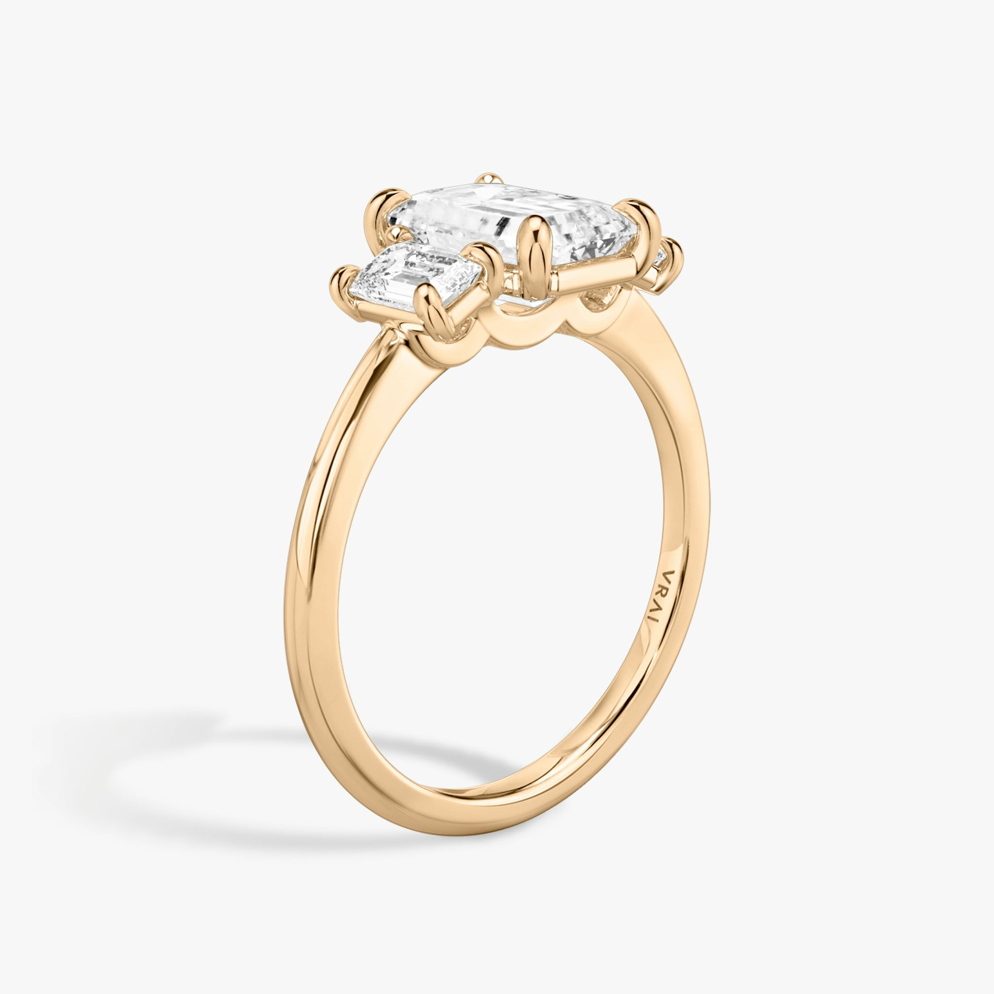 The Three Stone | Emerald | 14k | Rose Gold | bandAccent: Plain | sideStoneCarat: 0.25ct | sideStoneShape: Emerald | diamondOrientation: vertical | caratWeight: other