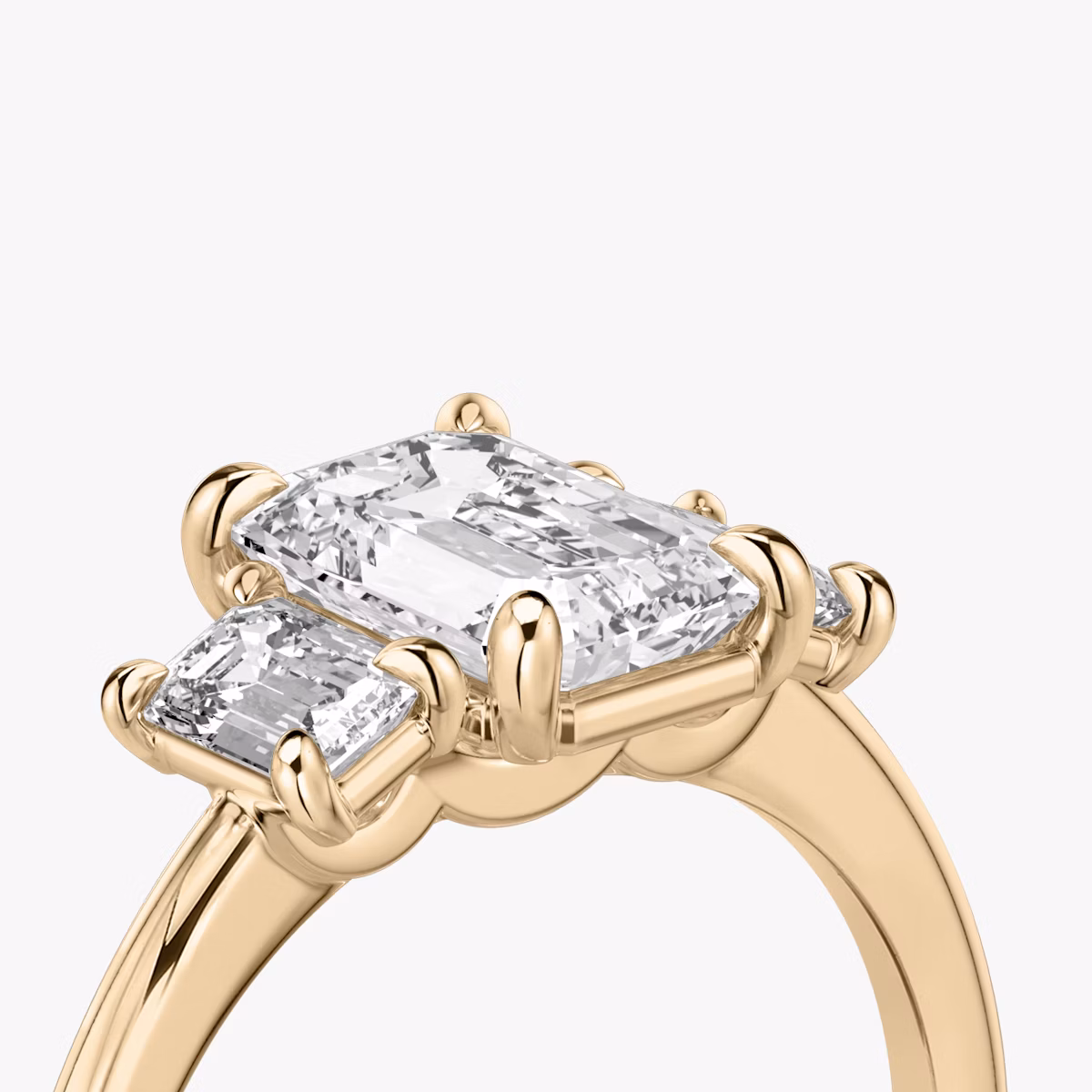 The Three Stone | Emerald | 14k | Rose Gold | bandAccent: Plain | sideStoneCarat: 0.25ct | sideStoneShape: Emerald | diamondOrientation: vertical | caratWeight: other