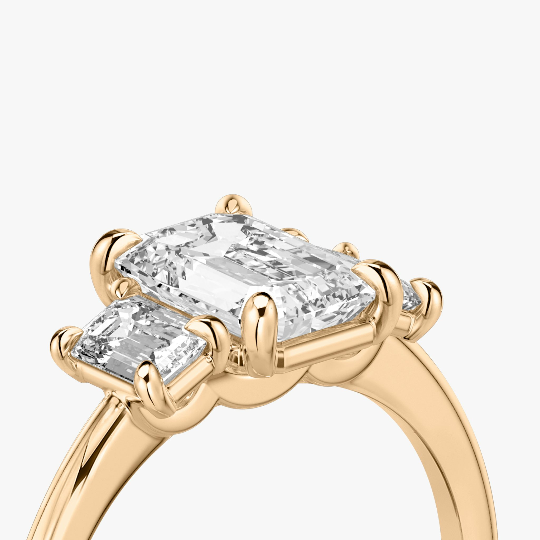 The Three Stone | Emerald | 14k | Rose Gold | bandAccent: Plain | sideStoneCarat: 0.25ct | sideStoneShape: Emerald | diamondOrientation: vertical | caratWeight: other