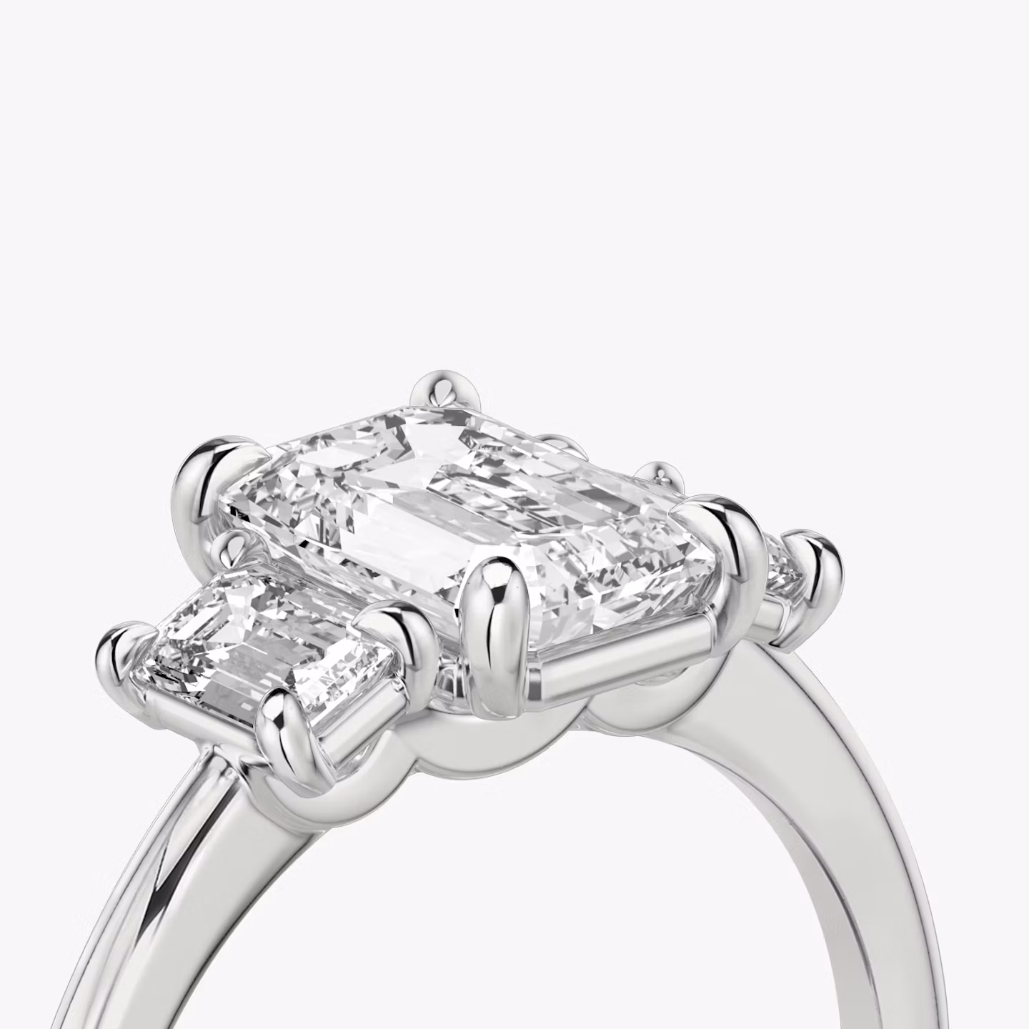 The Three Stone | Emerald | 18k | White Gold | bandAccent: Plain | sideStoneCarat: 0.25ct | sideStoneShape: Emerald | diamondOrientation: vertical | caratWeight: other