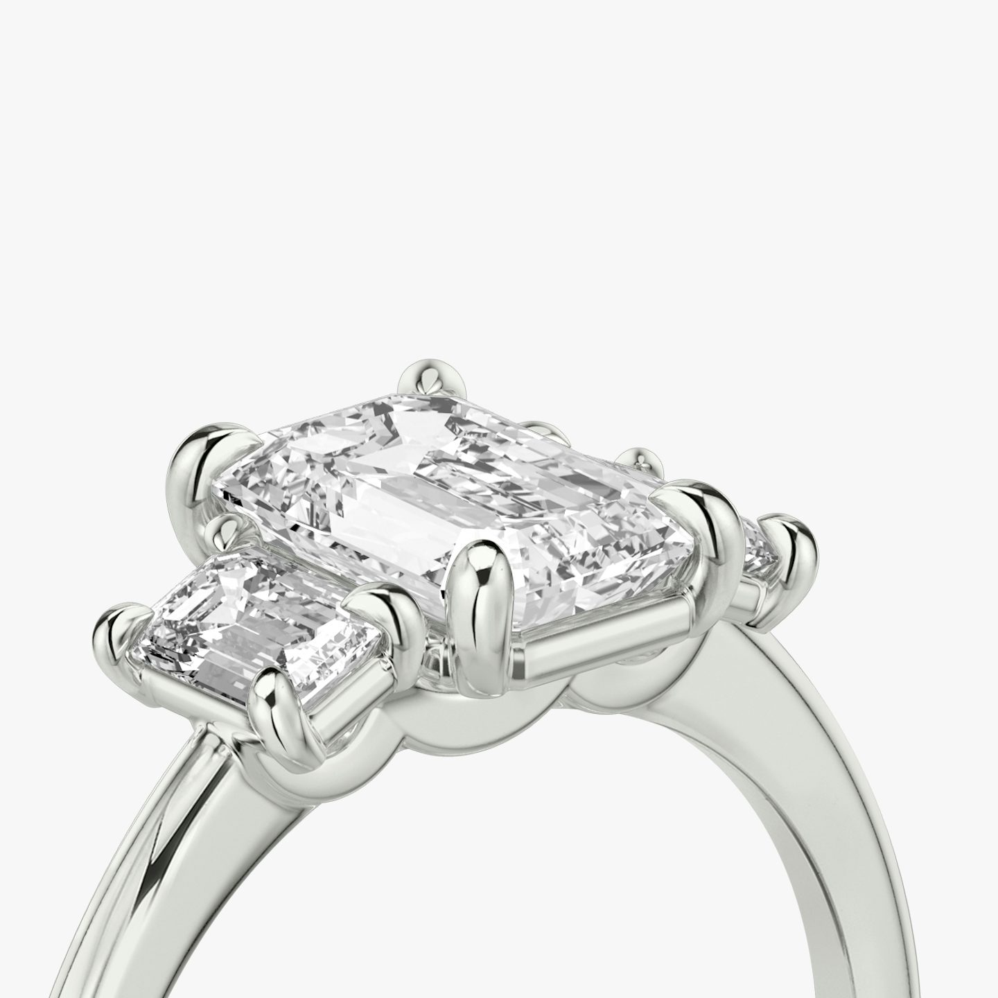 The Three Stone | Emerald | Platinum | bandAccent: Plain | sideStoneCarat: 0.25ct | sideStoneShape: Emerald | diamondOrientation: vertical | caratWeight: other