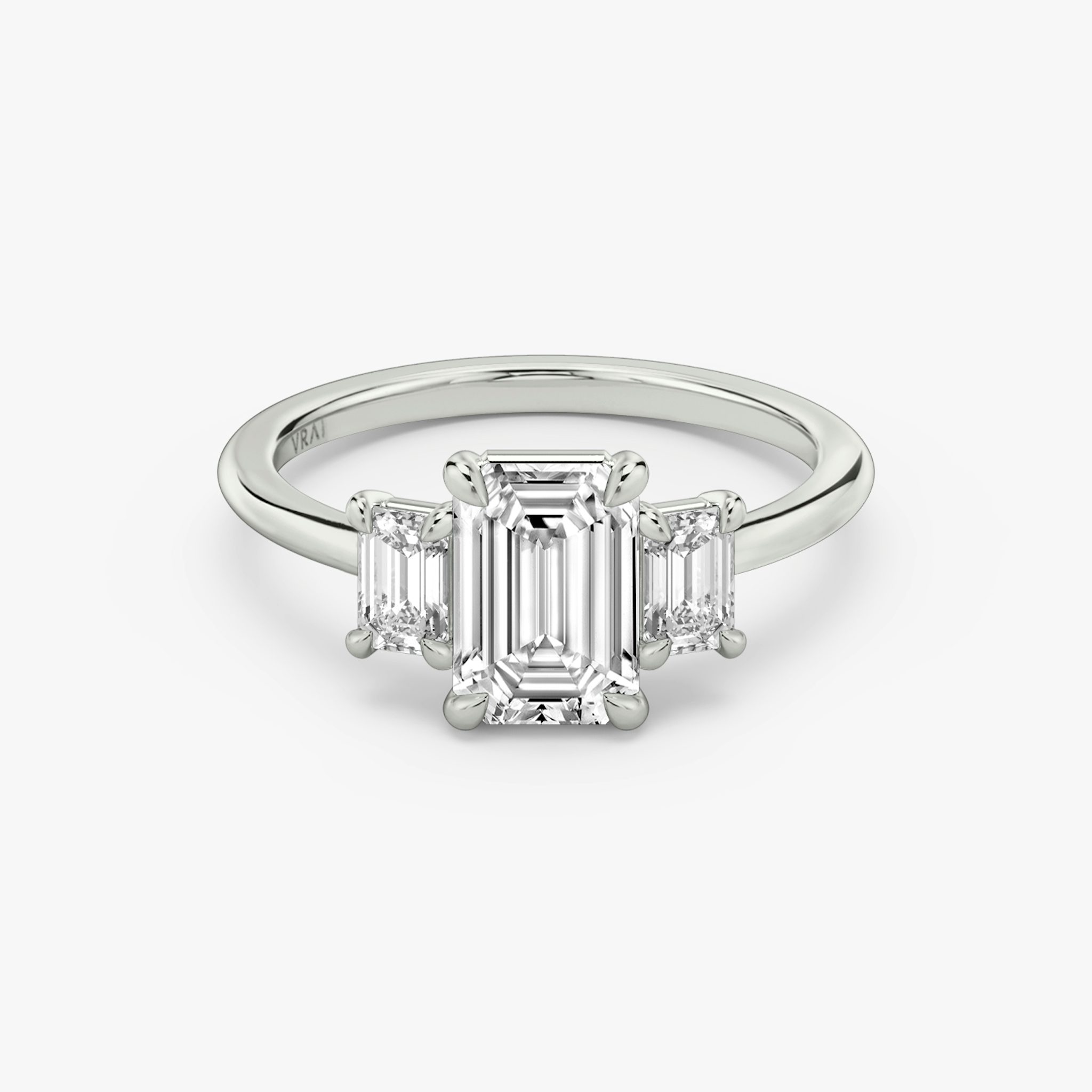 The Three Stone | Emerald | Platinum | bandAccent: Plain | sideStoneCarat: 0.25ct | sideStoneShape: Emerald | diamondOrientation: vertical | caratWeight: other