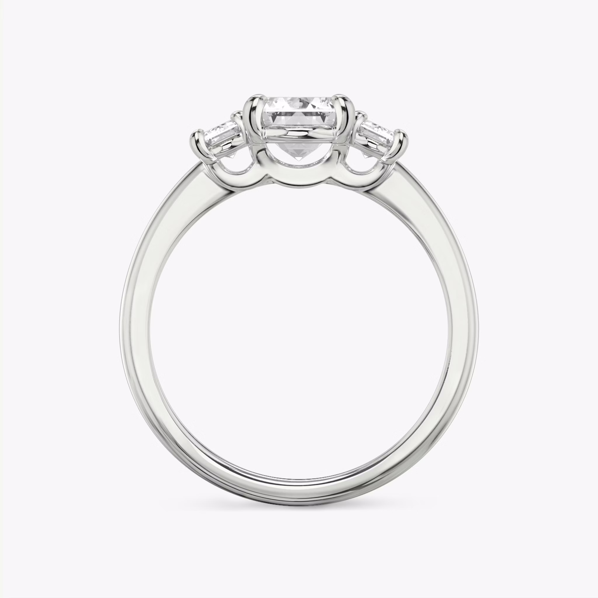 The Three Stone | Emerald | 18k | White Gold | bandAccent: Plain | sideStoneCarat: 0.25ct | sideStoneShape: Emerald | diamondOrientation: vertical | caratWeight: other