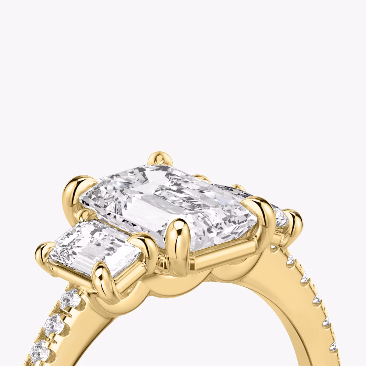 The Three Stone | Emerald | 18k | Yellow Gold | bandAccent: Pavé | sideStoneCarat: 0.25ct | sideStoneShape: Emerald | diamondOrientation: vertical | caratWeight: other
